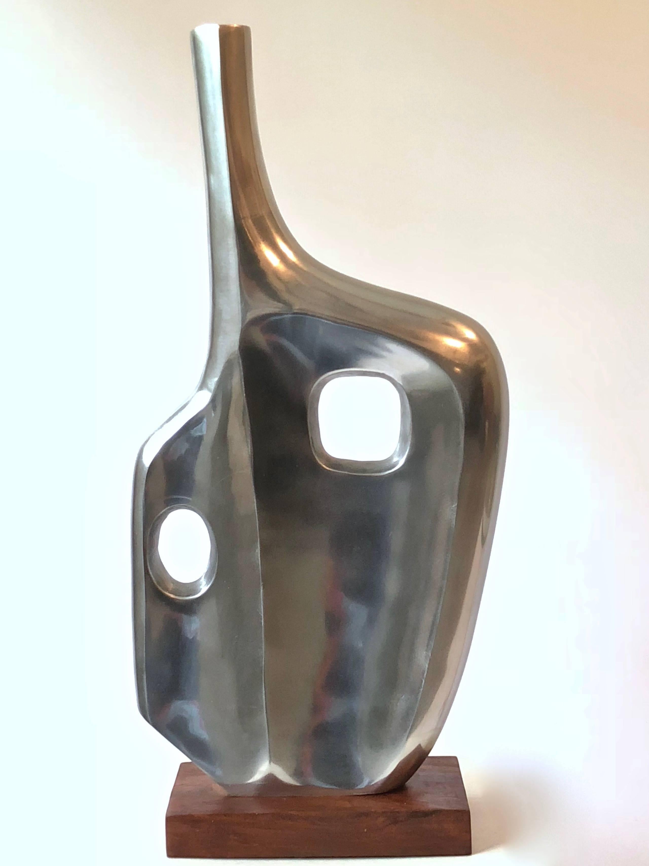 Graphic and large-scaled chromed abstract sculpture on black lacquered base, in the style of American sculptor, Dorothy Dehner (1901-1994). Similar piece published in October 2012, Elle Decor, Ivanka Trump's Living Room on Park Avenue.