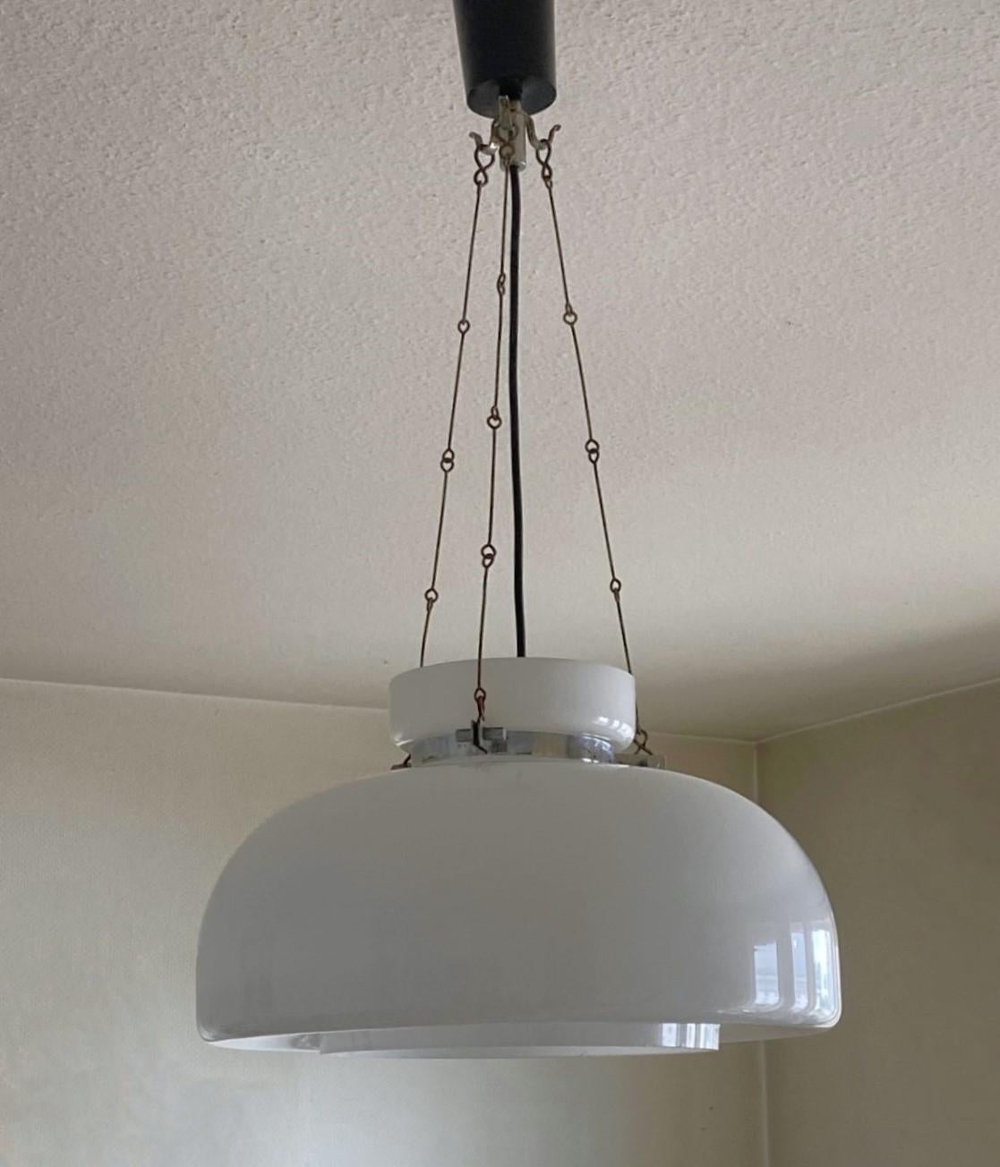 A rare Bauhaus opaline glass pendant or lantern, Germany, 1940-1949. Beautiful large opaline glass shade supported by three whronght iron chains and steel mounts. In very good original condition, no damages, rewired. It takes a single Edison E27
