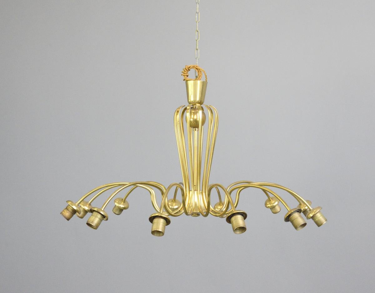 Large midcentury brass spider chandelier circa 1950s

- Curved tubular brass
- 12 arms
- Takes E27 fitting bulbs
- Comes with brass chain and ceiling rose
- German ~ 1950s
- Measures: 99cm wide x 66cm tall

Condition report

Fully re