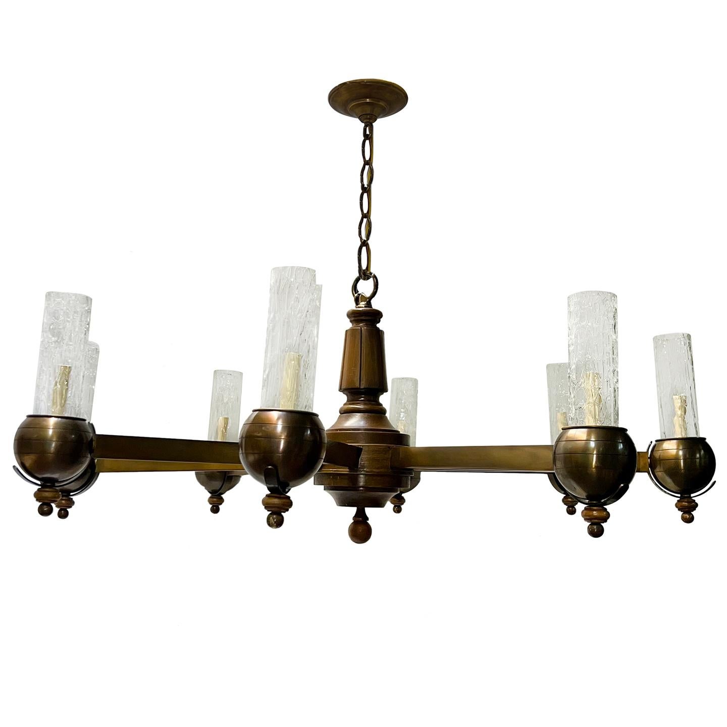 A circa 1950's Italian bronze and wood chandelier with glass insets and 8 lights.

Measurements:
Drop: 23