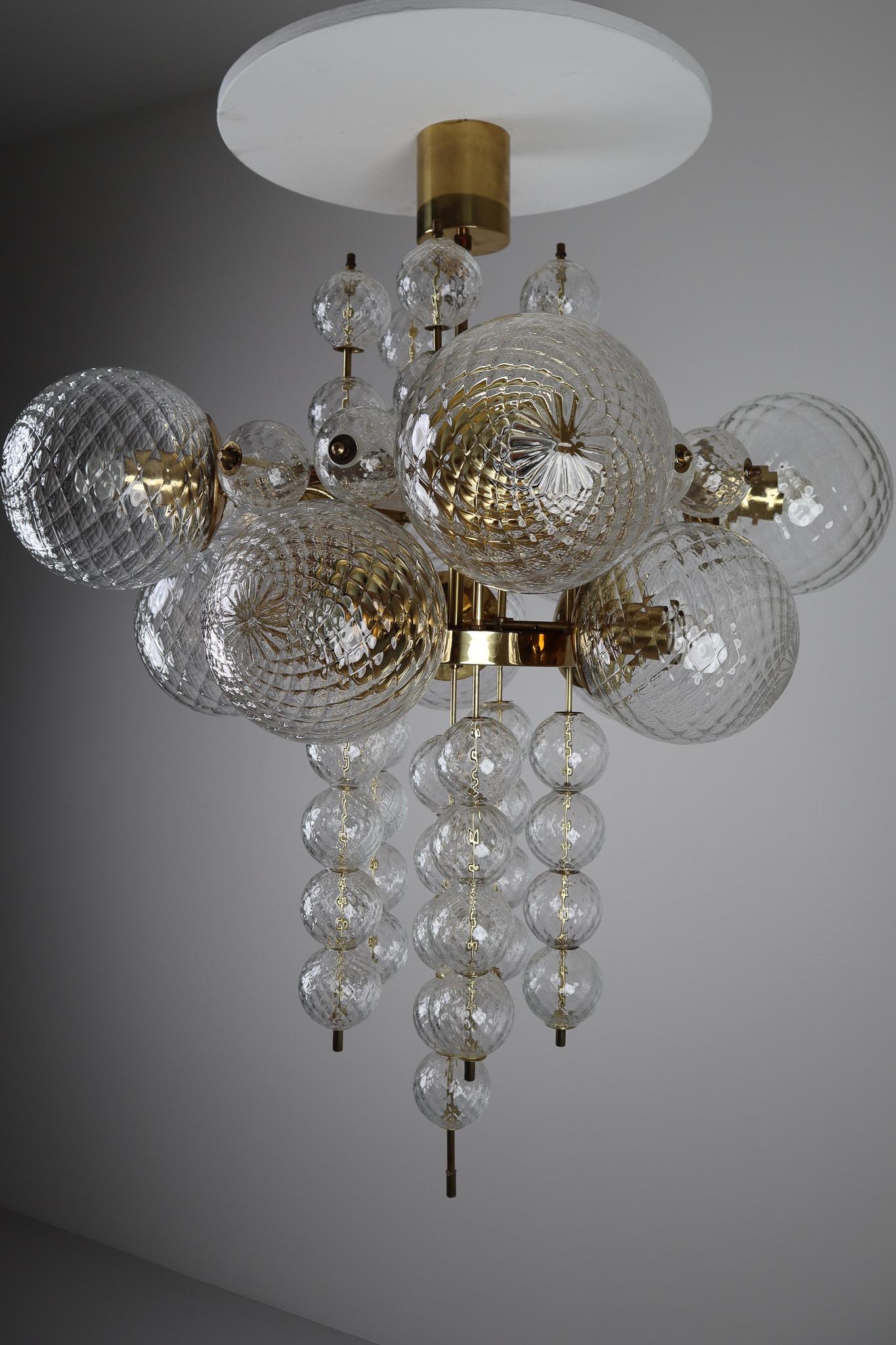 European Large Midcentury Chandelier with Brass Fixture and Structured Glass Europe 1970s