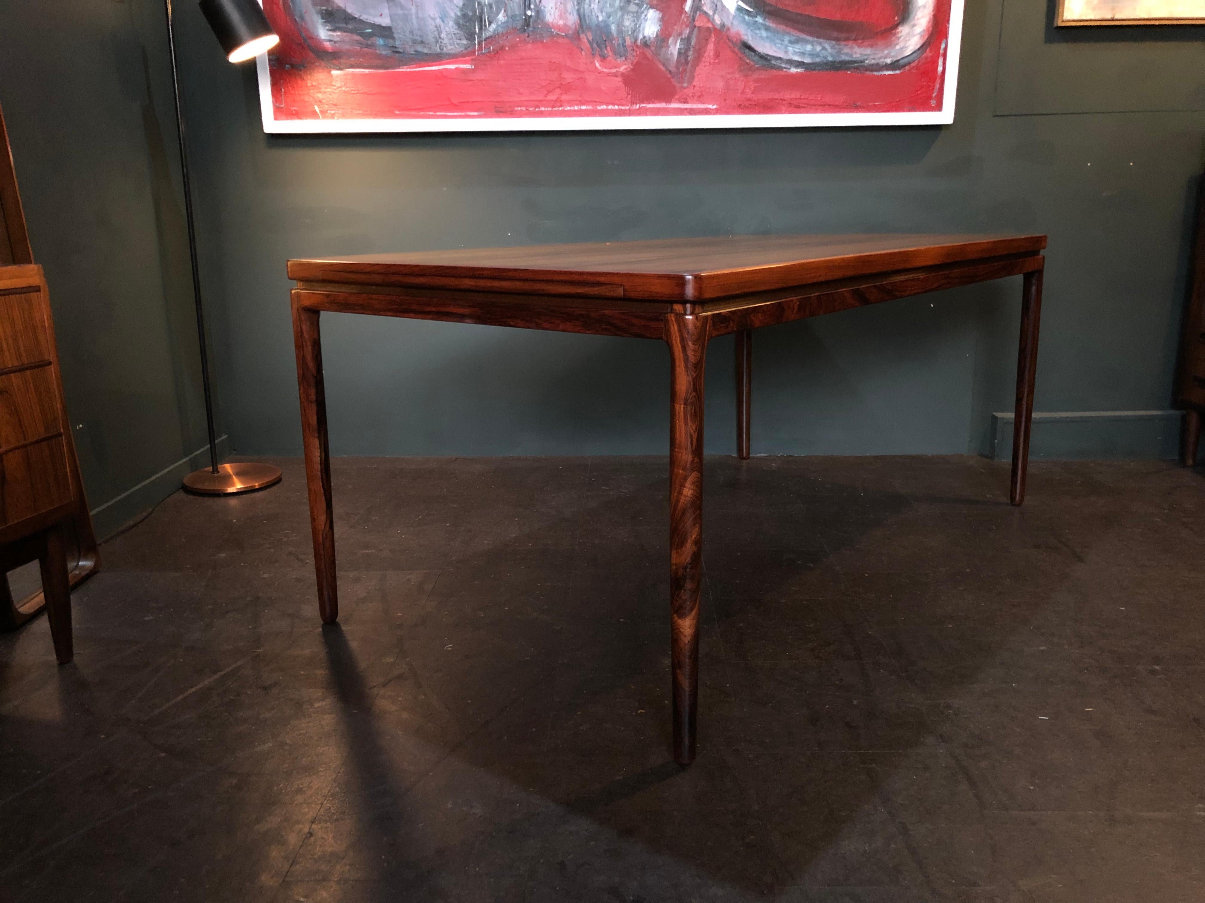 A stunning large midcentury Danish rosewood dining table designed by Johannes Andersen for Christian Linneberg, Denmark, circa 1960. Finest quality craftsmanship and wonderful design as you would expect from Andersen and Linneberg. A Large size