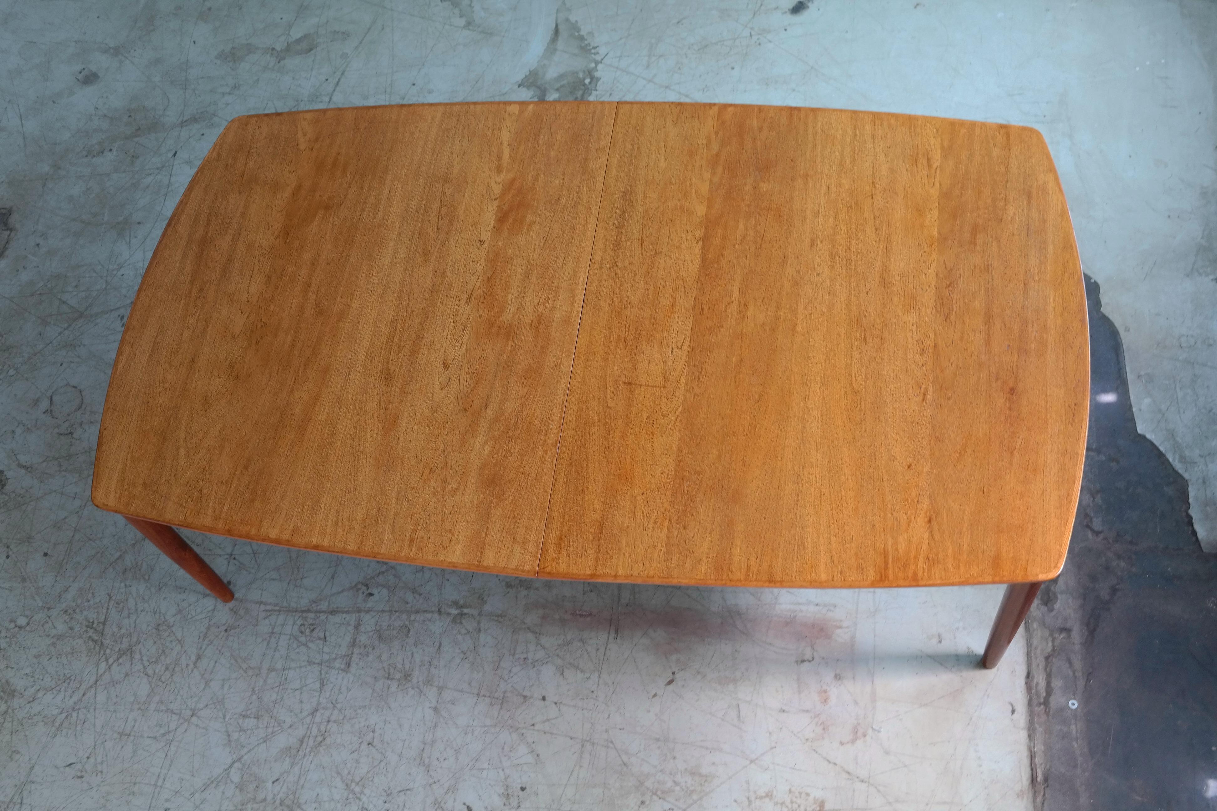 Rare to find Danish conference Table fro the late 1960s. Beautiful armrests and legs in carved elm wood with great grain and color. It has 8 matching chairs attributed Fritz Hansen that are sold separately. The chairs and matching conference table