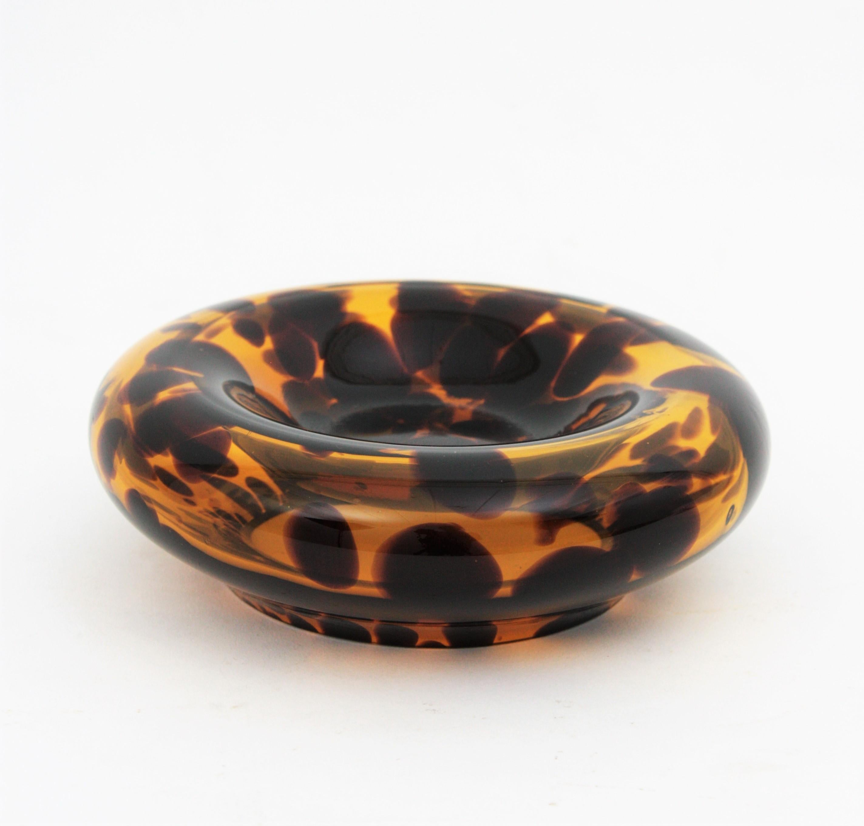 Beautiful hand blown tortoiseshell Empoli glass round bowl or ashtray, Italy, 1960s.
Manufactured by Empoli for Christian Dior Home collection. Mouth-blown with exclusive tortoiseshell color flowing pattern.
It can be used as cigars / cigarrettes
