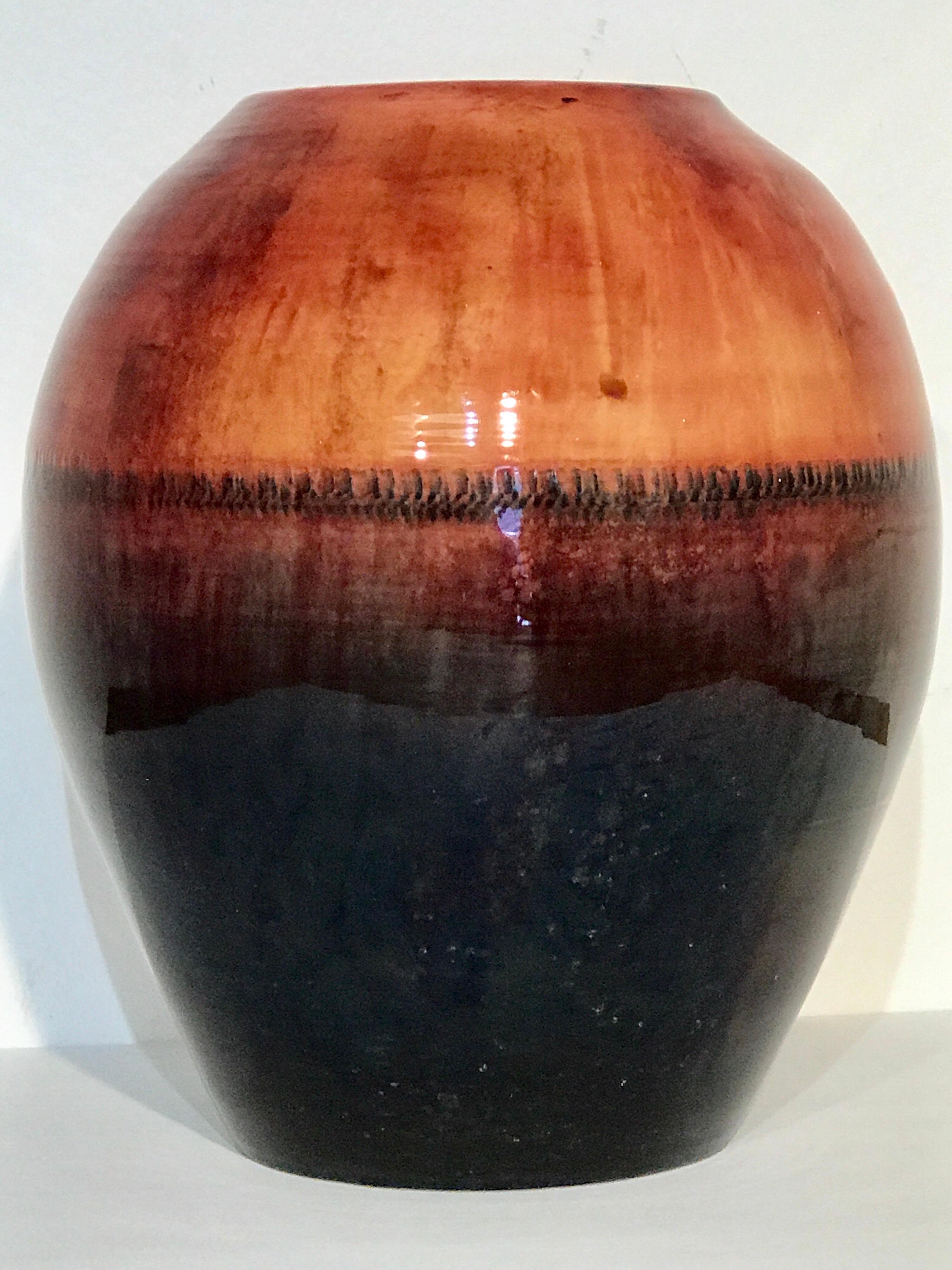 Rare large midcentury flambé vase, by Walter Moorcroft, with continuous incised decoration, date marked for 1947-1953. Measures: Standing 12