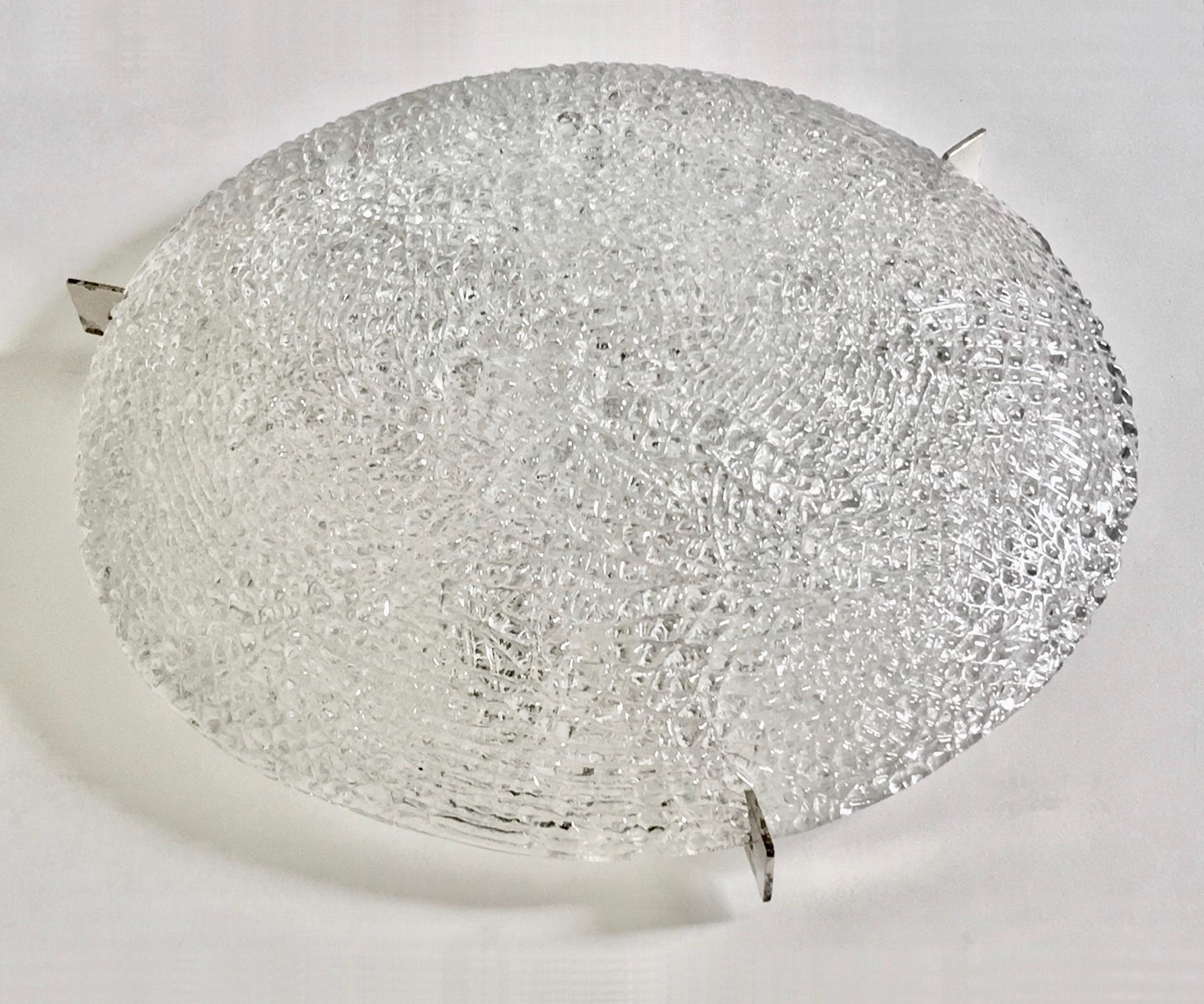 *** Special price for Black Friday / Cyber Monday ***

Large glass flush mount by Kaiser, Germany. Mid-20th century.

Single piece of handcrafted textured clear glass held in place by three chrome-plated brackets. The ceiling plate is white metal,