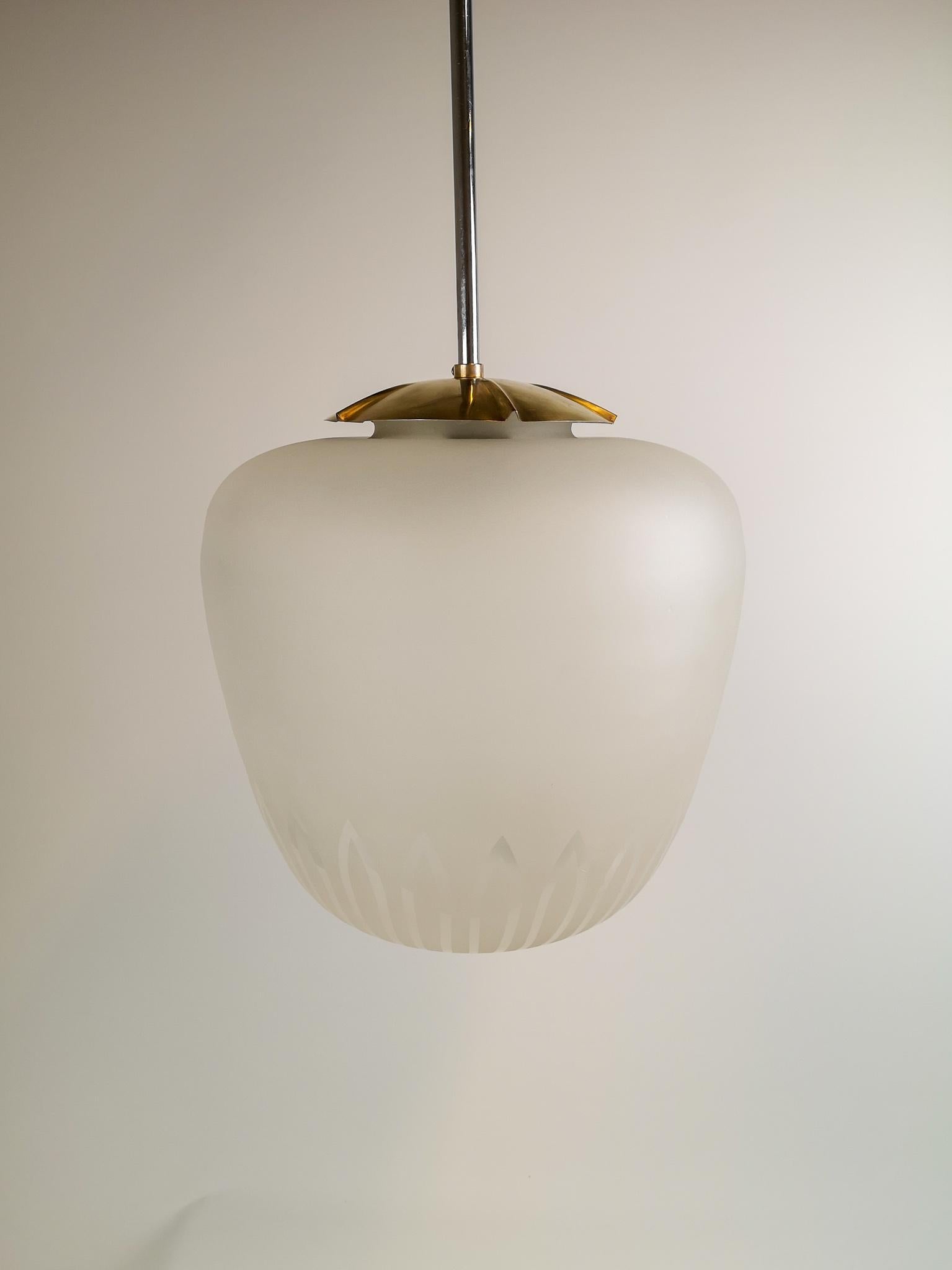 This large glass pendant produced by ASEA, Sweden, 1940-1950s. 

Good condition, with a small chip in the fitting of the glass. 

Measures: The glass H 35cm, D 35cm total height 82 cm.

  