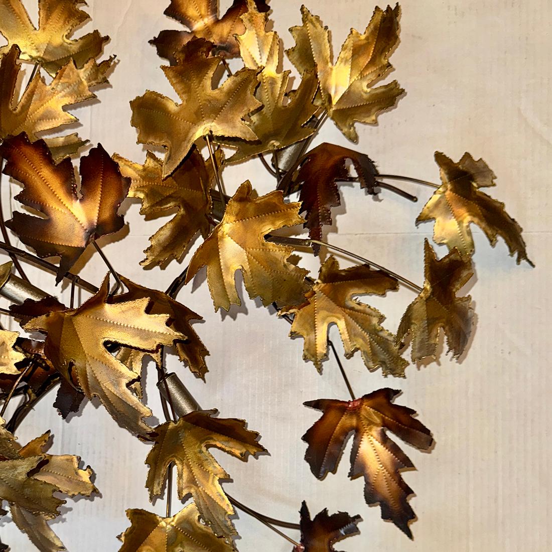 A circa 1960's Italian foliage motif long light fixture with 14 candelabra lights.

Measurements:
Length: 61