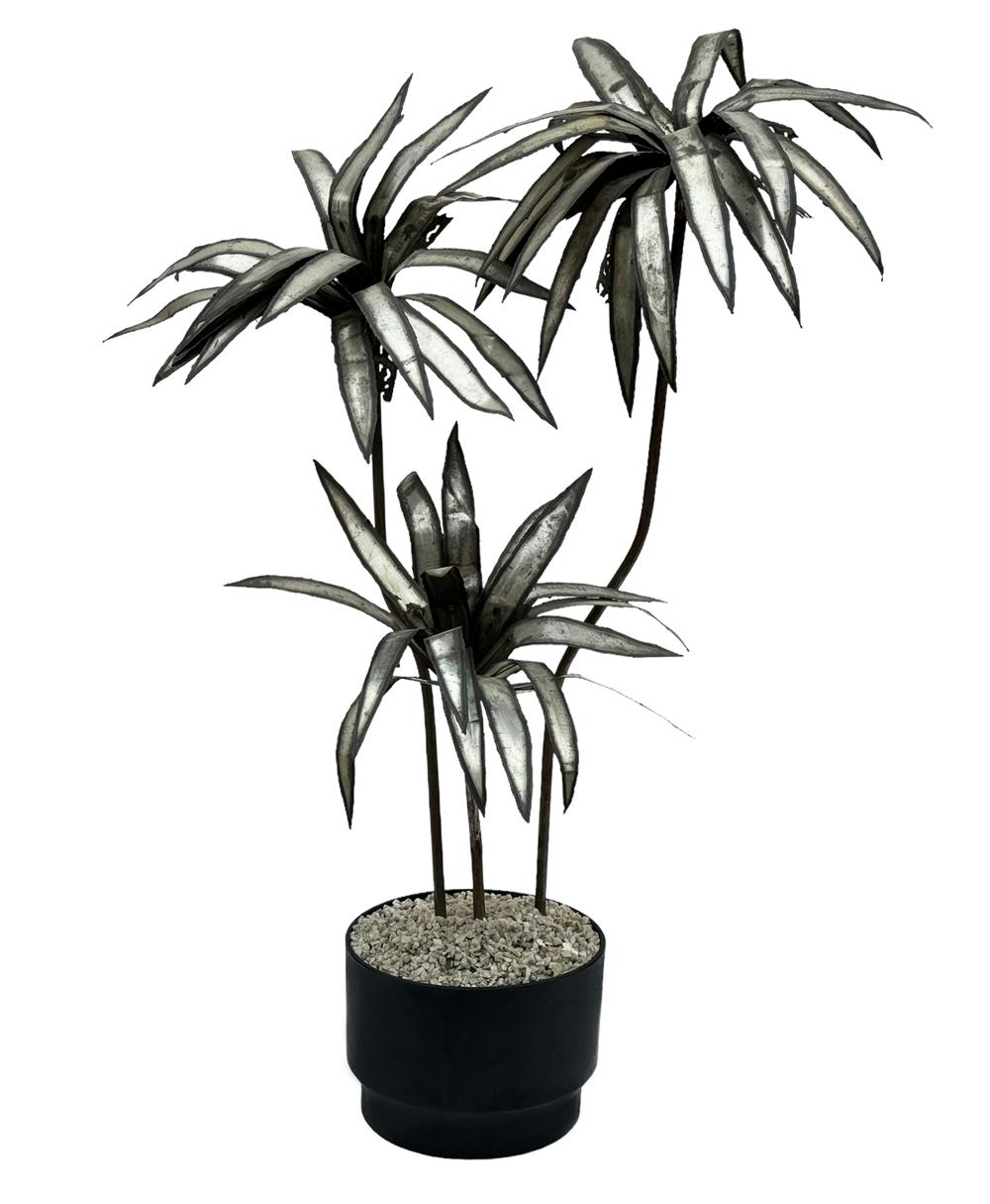 A large and impressive torch cut palm tree sculpture, circa 1970s. It features an all aluminum & steel construction. Nice warm patina. Leaves are adjustable so you can style and model to suit your needs.