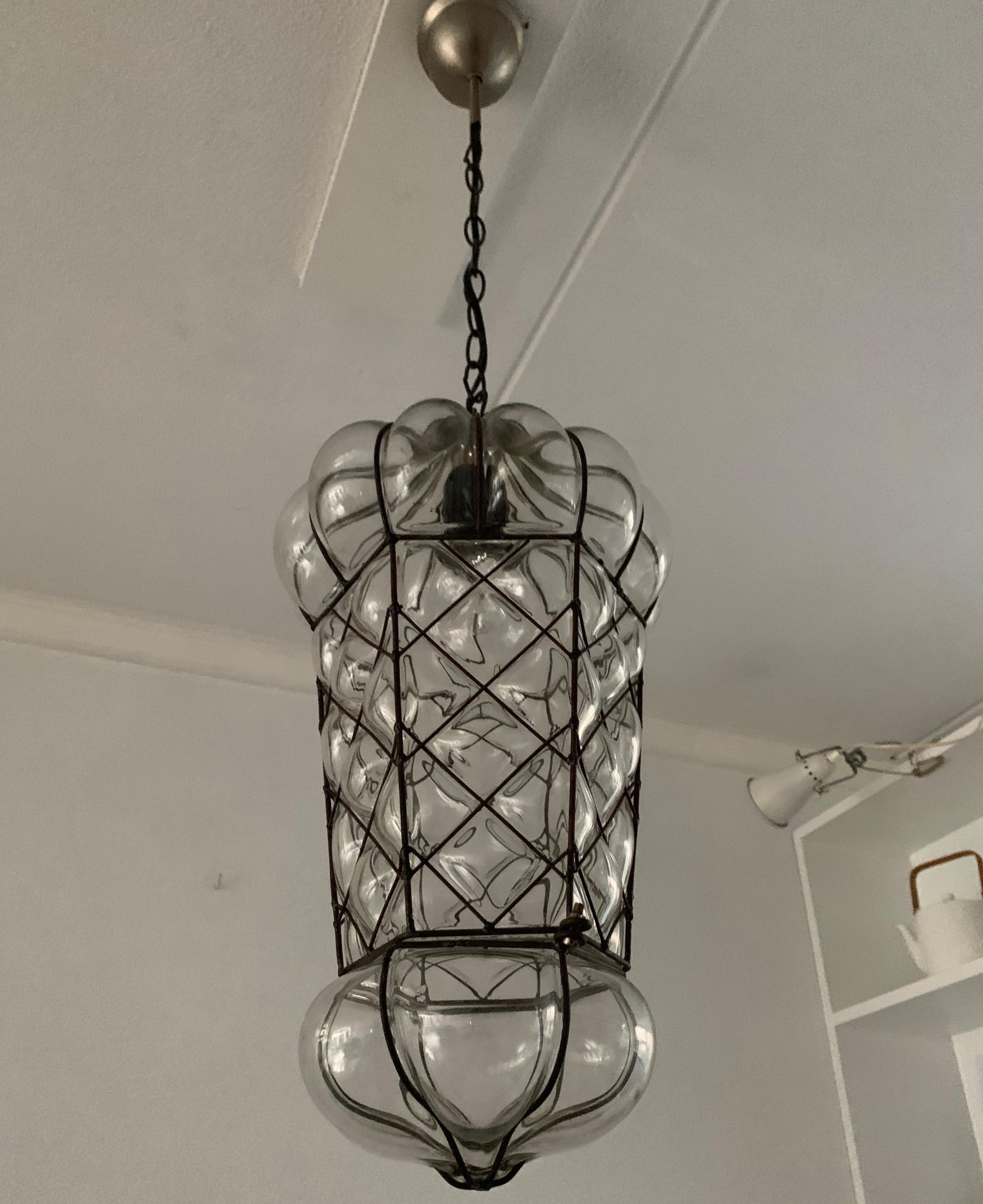 Great condition transparent glass light fixture.

This large size and very decorative pendant is one of our latest finds and we have the pleasure of offering it to you in this excellent condition. We have completely rewired it for safe and immediate