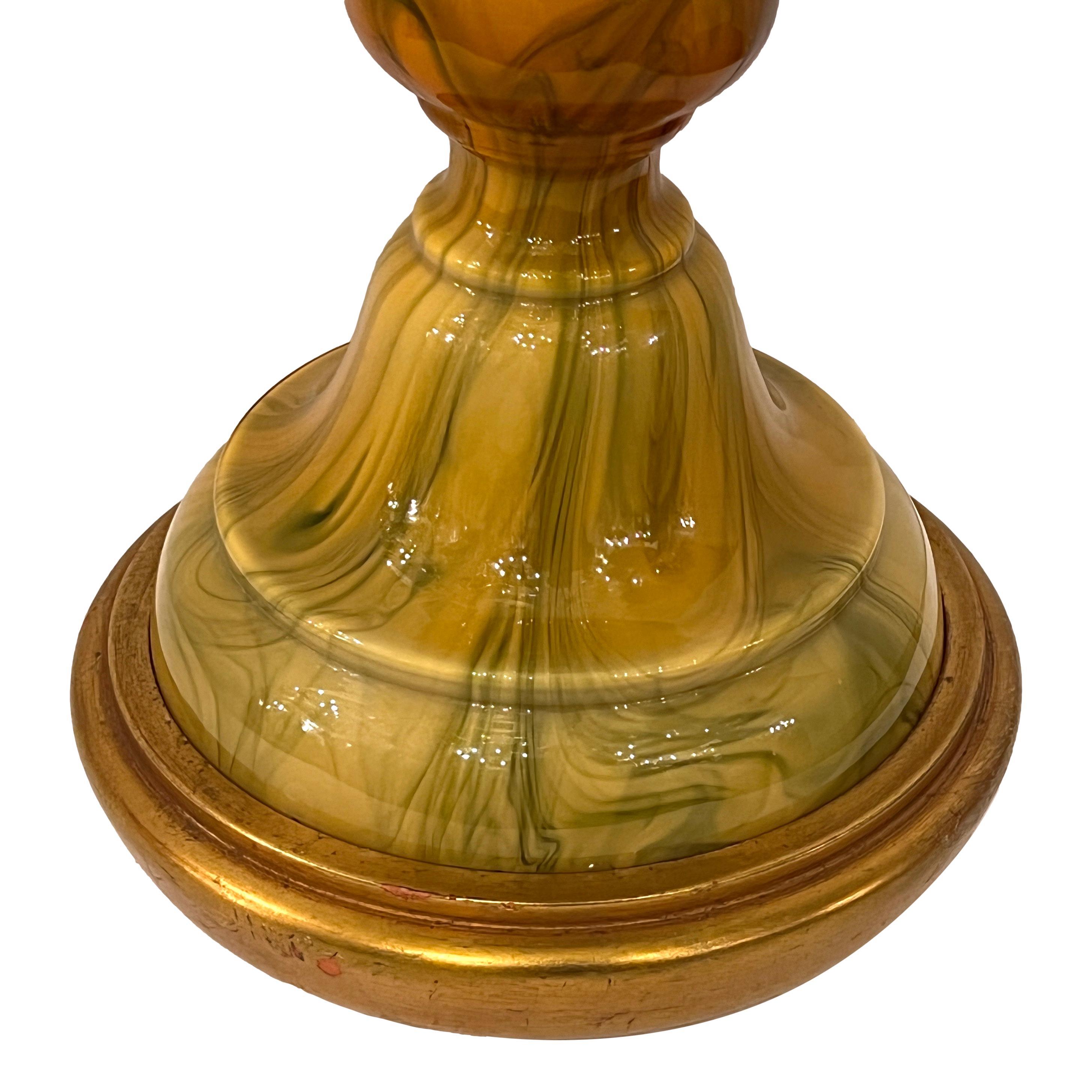 A circa 1960s Italian Murano art glass table lamp with gilt base. 

Measurements:
Height of body: 23