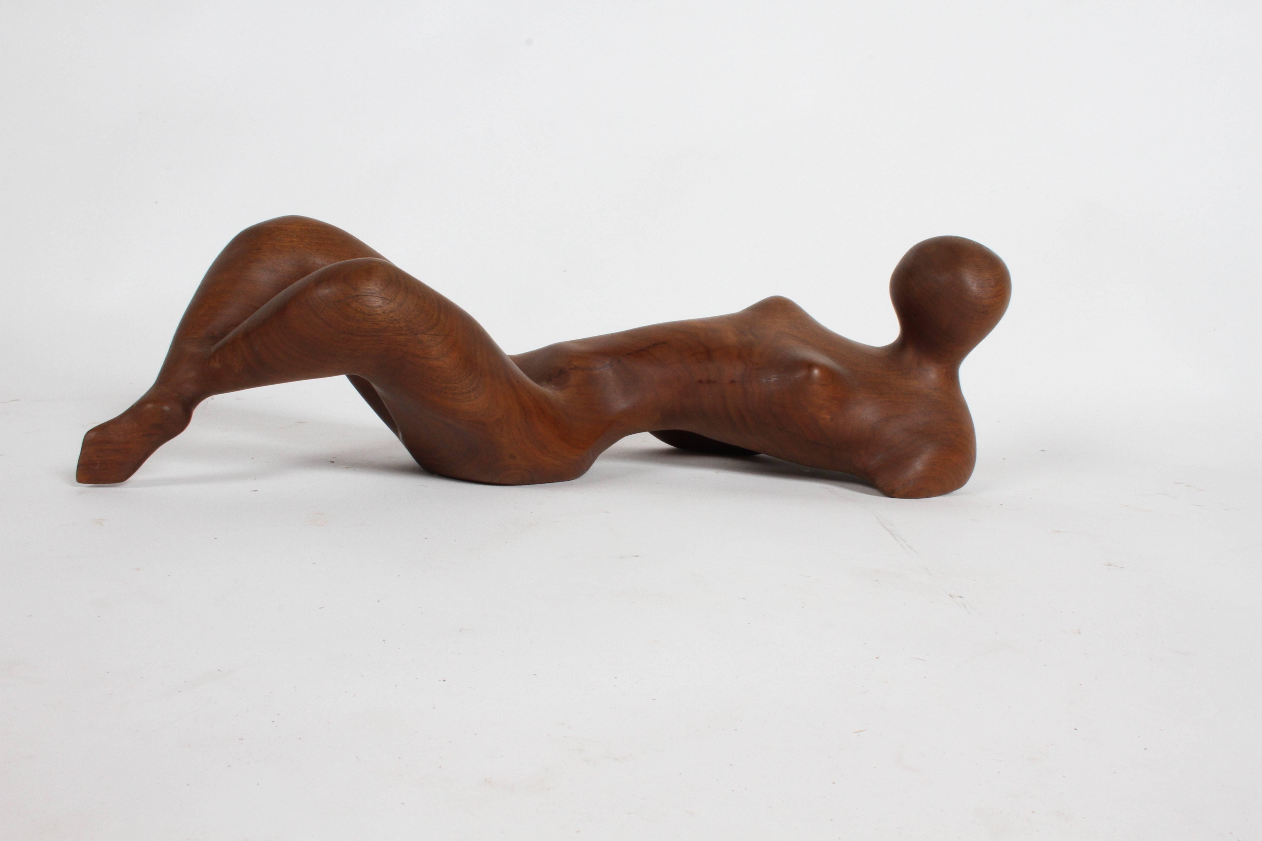 Mid-Century Modern carved mahogany reclining abstract nude female form sculpture. Though it is unsigned, it is possibly by William Conrad Severson. As there was another large wood female abstract nude sculpture signed by Severson 1957 from the same