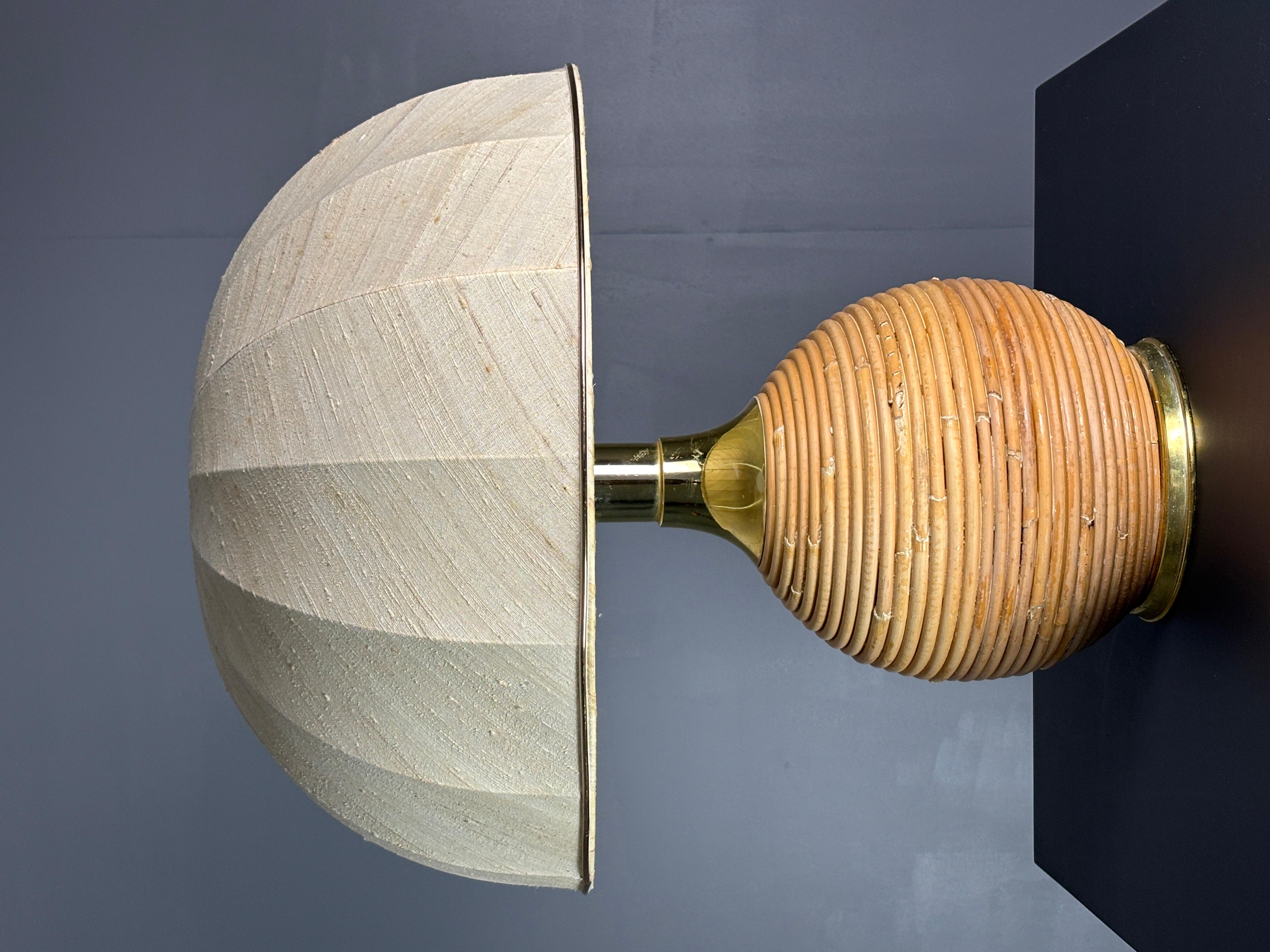Gorgeous pencil reed rattan table lamp with brass. This lamp will come with this lovely 1960s mushroom ( not original to the lamp )  shade as shown in the pics. The lamp is fitted for a general E27 lightbulb. We currently have two of these larger