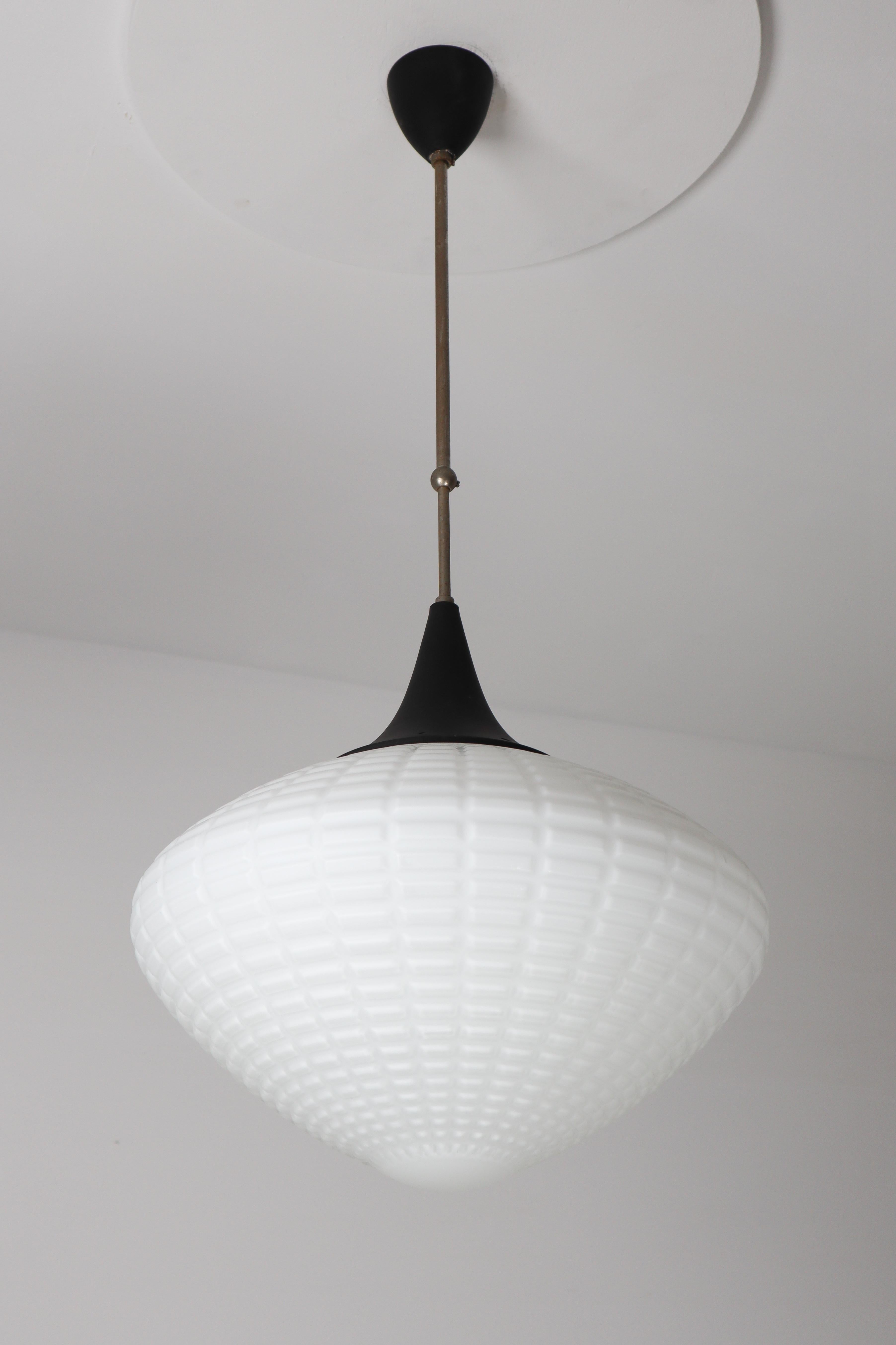 Large midcentury pendant, structured opaline glass, Europe, 1960s. The diffuse light it spreads is very atmospheric. Completed with the opaline glass and metal steel painted canopy on a telescopic rod, these pendants will contribute to a luxurious