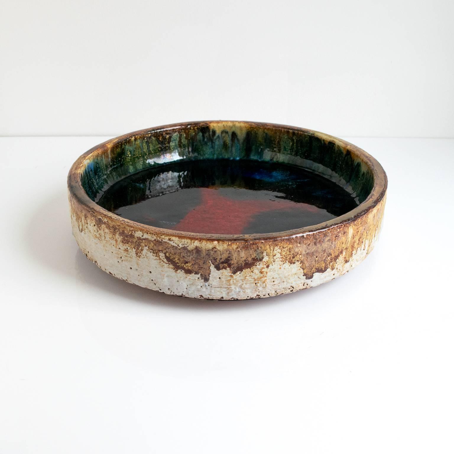 A large expressionistic midcentury Scandinavian Modern multicolored thickly glazed bowl.

Dimensions: Diameter 12, height 3”.