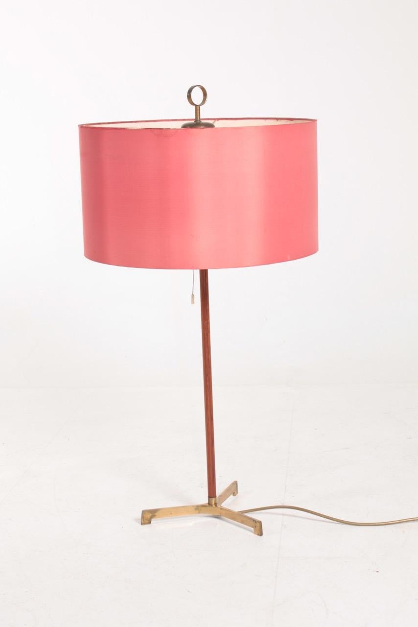Large table lamp in teak and original shade designed and made in Denmark. Original condition.