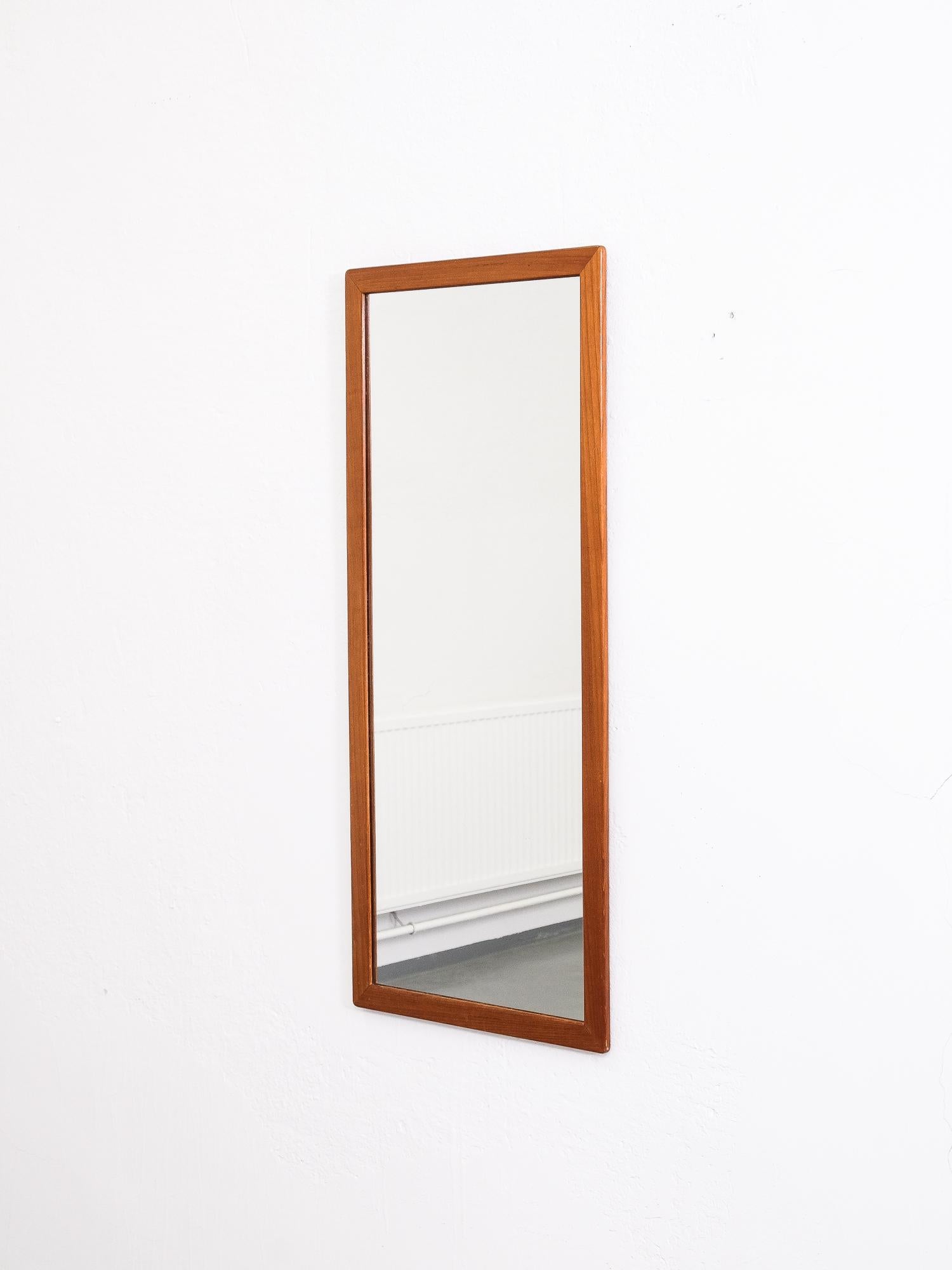 Great quality and stylish Swedish wall mirror from 1960s. Solid teak frame.
