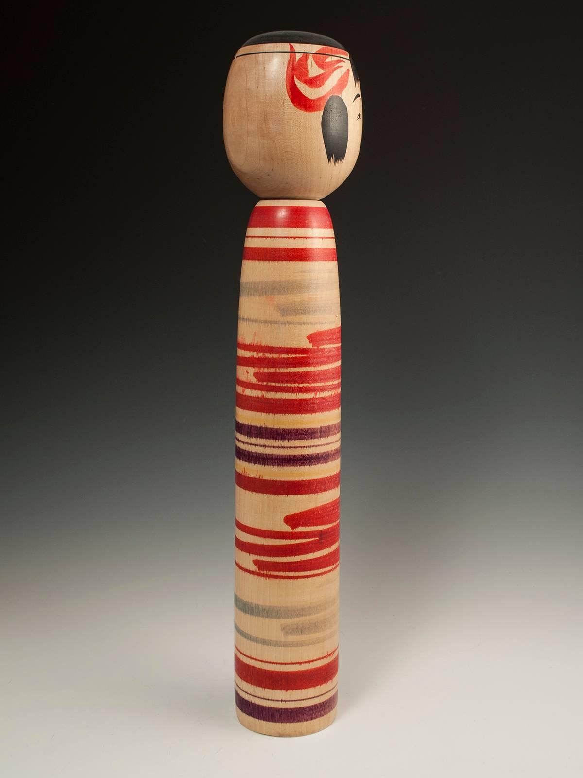 Midcentury traditional Kokeshi doll from Tsuchiyu, Japan

A large classic traditional kokeshi doll signed by Watanabe Chuzo
Kokeshi from the Tsuchiyu area of Japan are characteristically decorated with stripes, which are hand-painted in water color