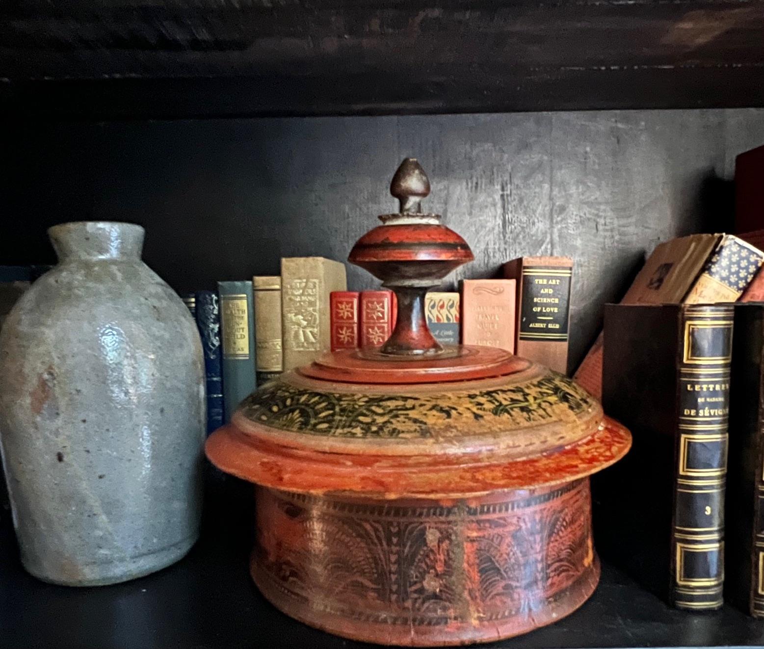 Large round hand-turned, and hand-painted lidded antique tribal wooden spice box, likely from Pakistan, made around 1900.   