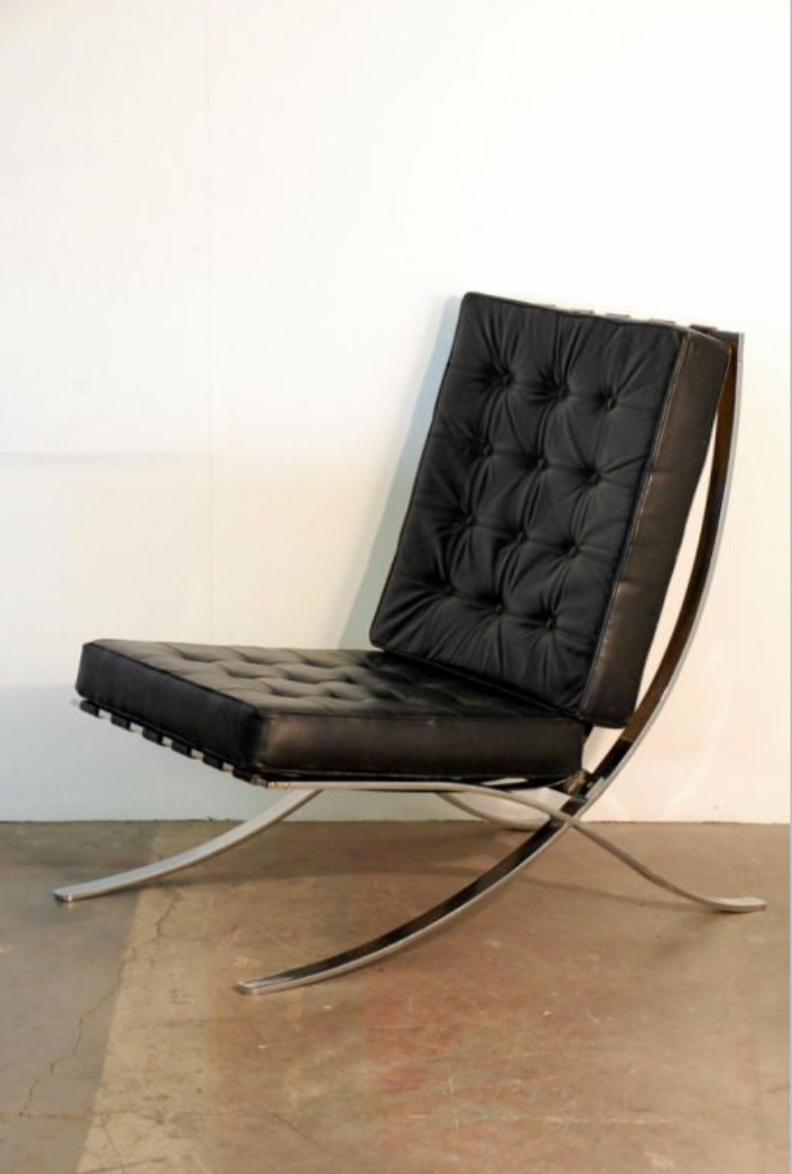 Large Mies van der Rohe style black leather lounge chair. Not the usual copy of the Barcelona chair. 18 in. seat height. 3 chairs are available. Priced Individually.