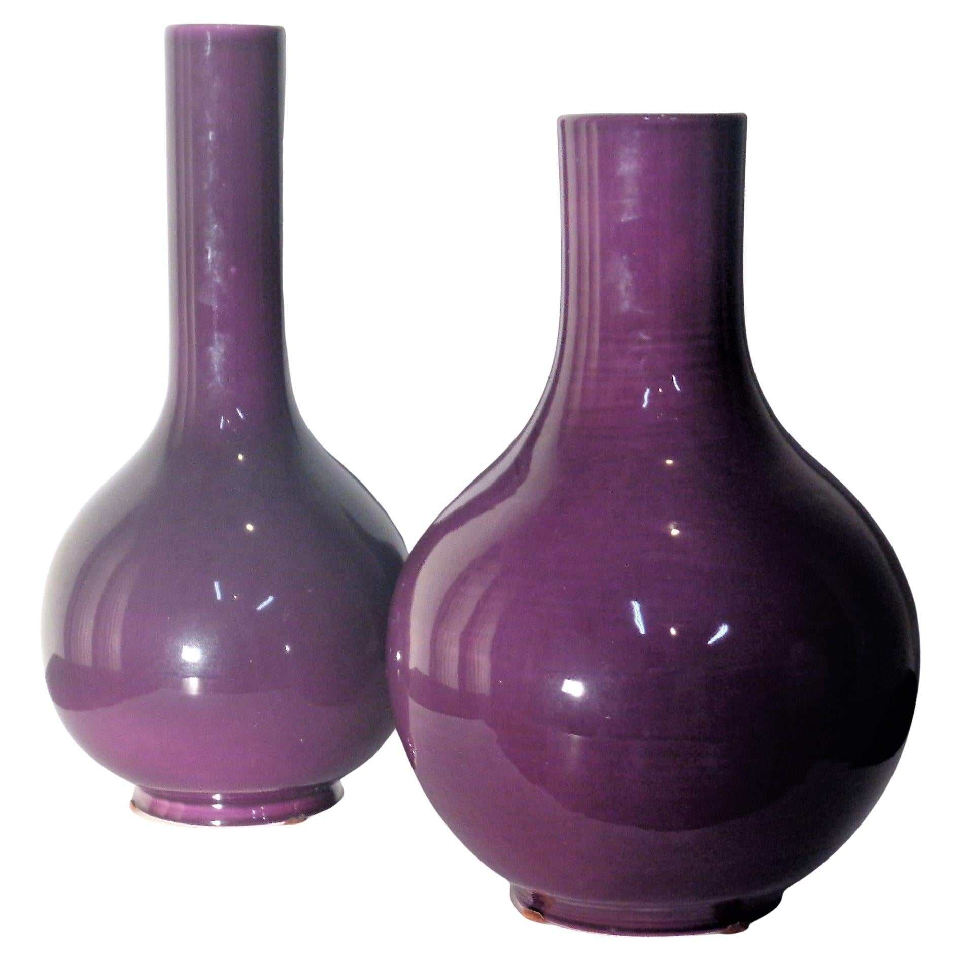 Two large high glazed plum purple porcelain vases in the classic Ming style with gold foil labels on underside - A Nora Fenton Import, Made in Italy. Great quality beautiful decorative items. Circa 1970's-1980's. Taller vase measures - 18 1/2