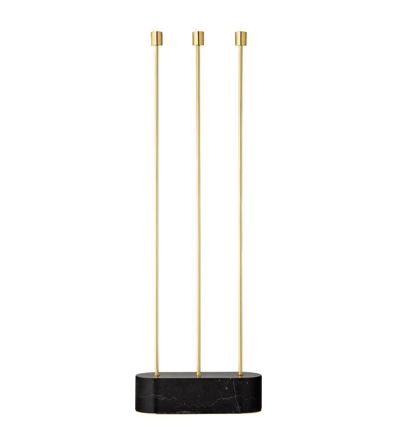Large minimalist candleholder
Dimensions: D 27 x W 9 x H 82 cm 
Materials: Steel. Marble. 
Available in sizes small and medium and, in black.

With a solid marble base and exquisite brass or black details, the Grasil candleholders provide a