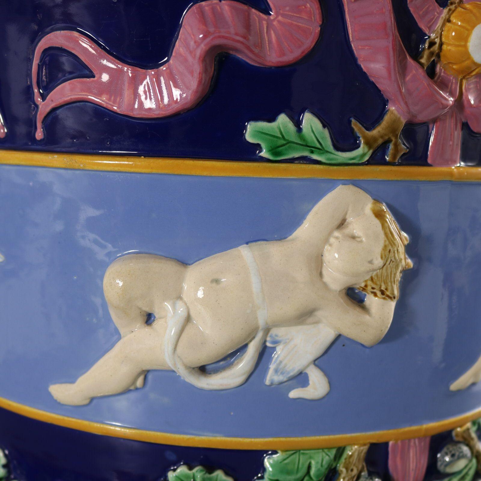 Late 19th Century Large Minton Majolica Cupids Jardiniere And Stand For Sale