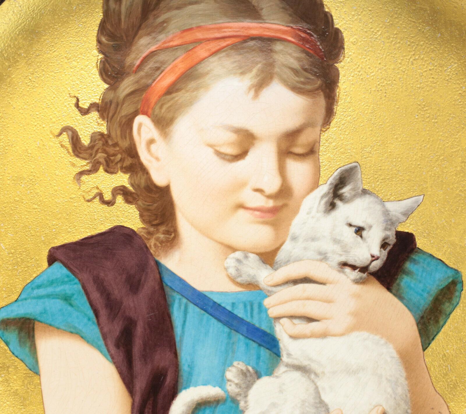 A large Minton porcelain hand painted wall charger, 1880. The finely hand painted charger charmingly depicts a young girl holding a cat with a gilt textured background. Signed 