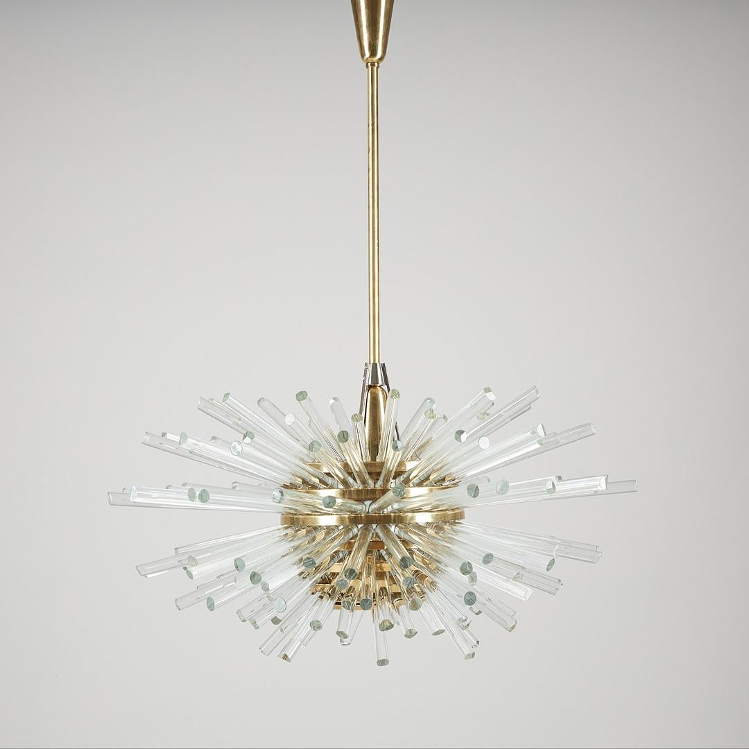 Brass and glass rods chandelier, 1960s. Brass frame partialy nickel-plated with glass rods. Fitted with one E27 bulb up to 500Watts. Excellent condition.  The total height can customized.
  