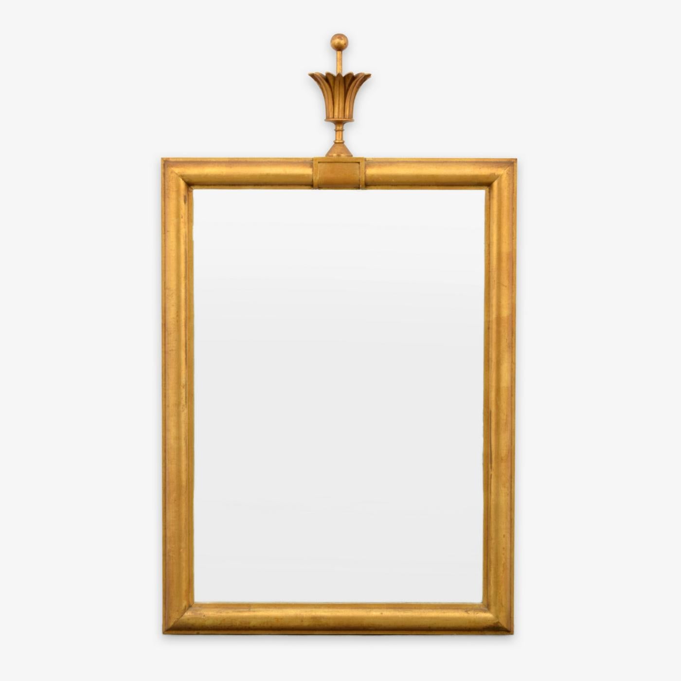 Gold mirror with finial on top attributed to Tommi Parzinger.

Tommi Parzinger's meticulous detail in his early work as a silversmith was carried over into his design career.  He favored costly materials that allowed him to achieve a luxurious and