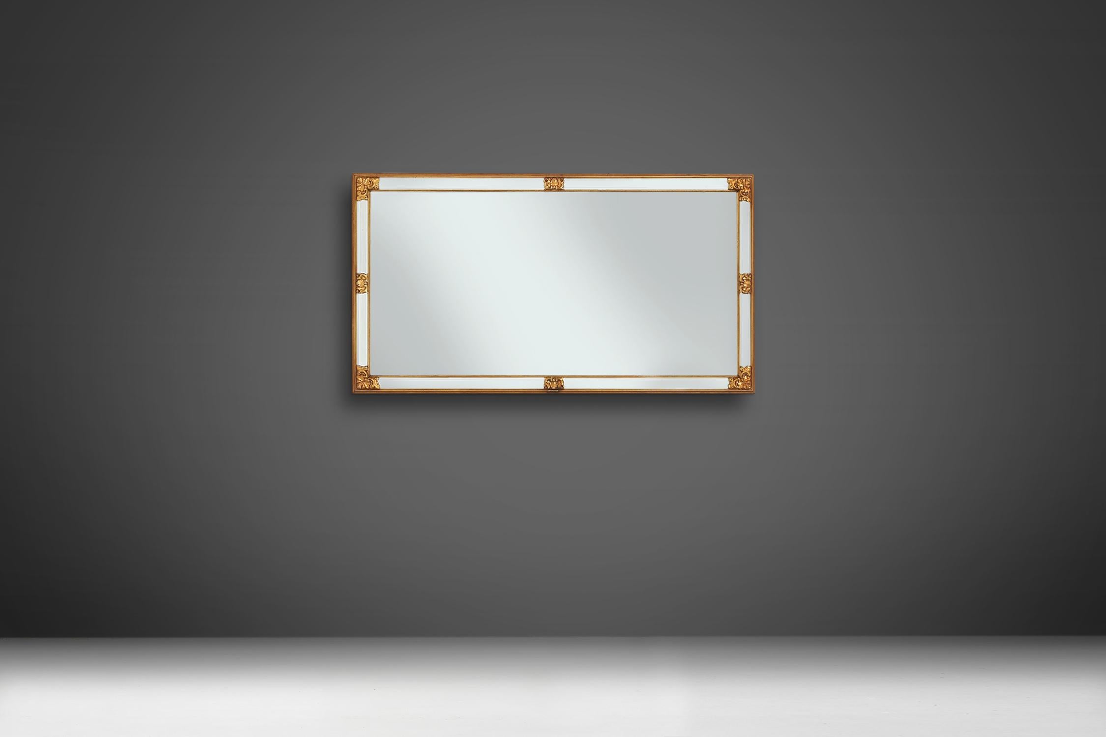 Belgian mirror by brand Deknudt made in the 1970s.
This large model with some great golden details and cut glass.
The mirror can be placed horizontal and vertical.