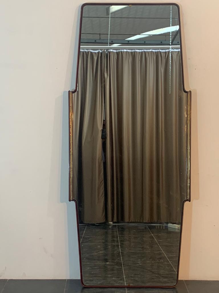 Mirror by Osvaldo Borsani for Turri, 1950s. Wooden frame with brass meander that has some flaws (see photos). Mirror generally placed on sideboard horizontally, revised and restored in the side that rested on the cabinet for vertical