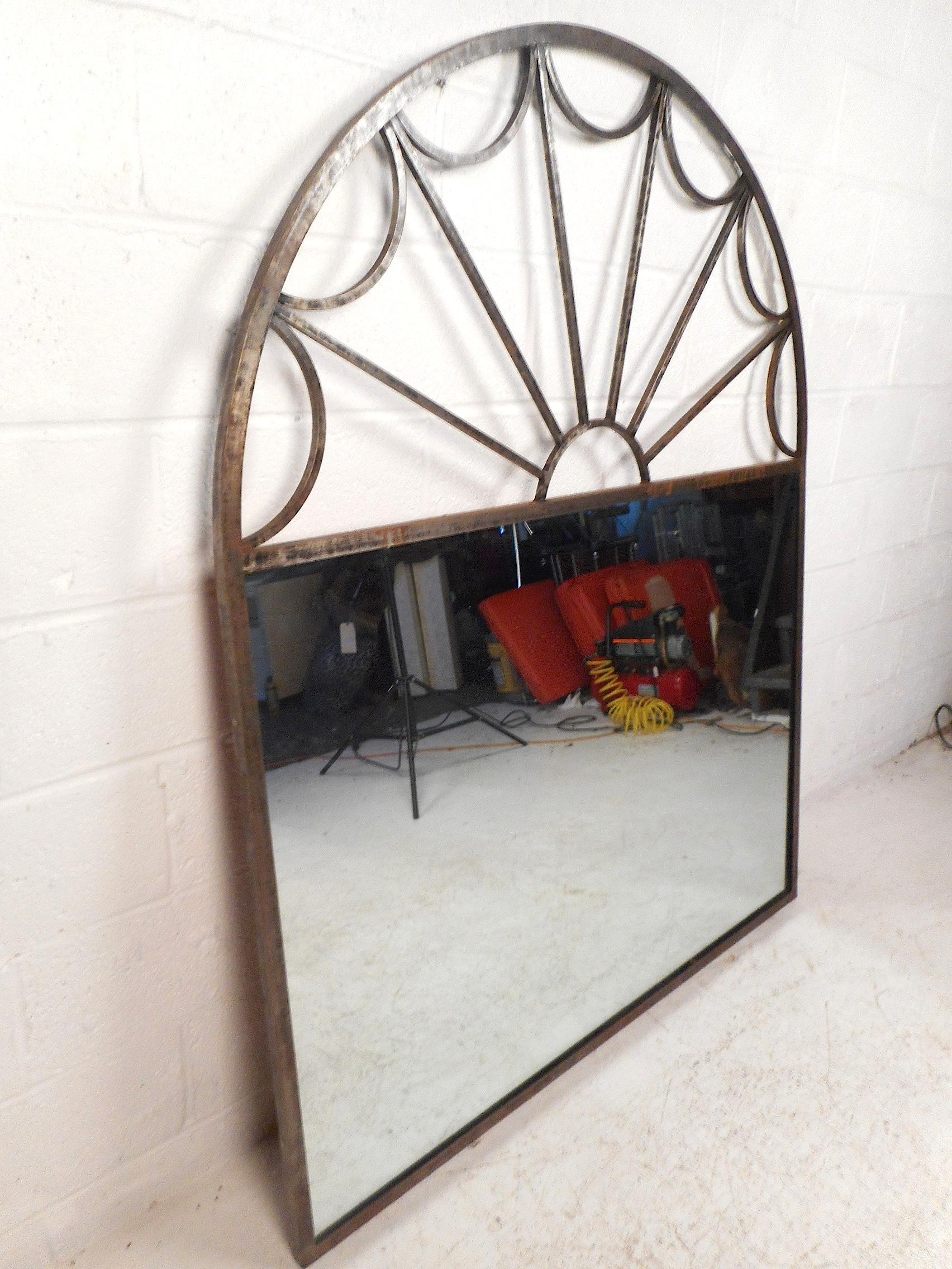 Large mirror encased in a decorative arched iron frame. Sturdy construction sure to add depth to any interior. Please confirm item location with dealer (NJ or NY).