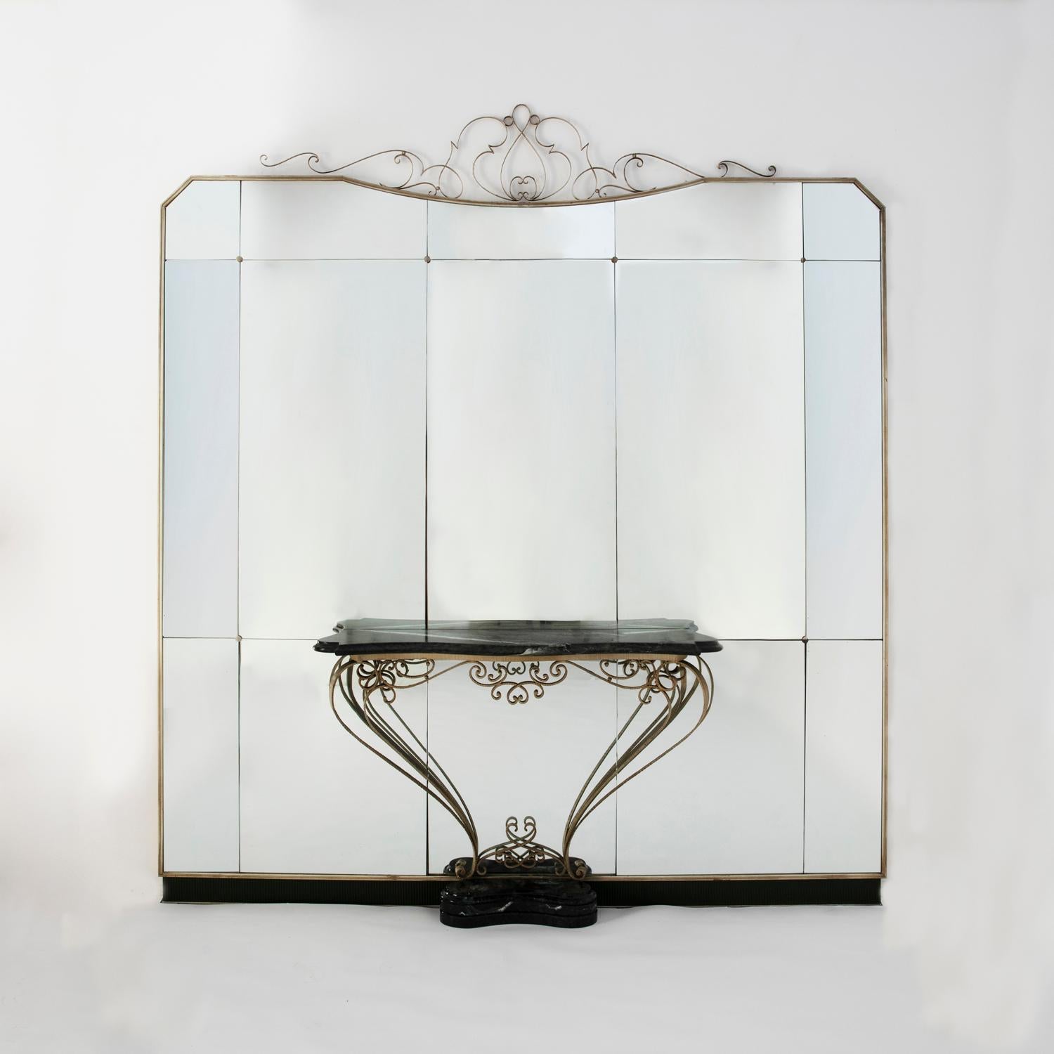 Large mirror with marble console manufactured by Colli in the early 1950s for a private commission. The entire structure around the mirror and the console support is made from wrought iron, console base and top in green 