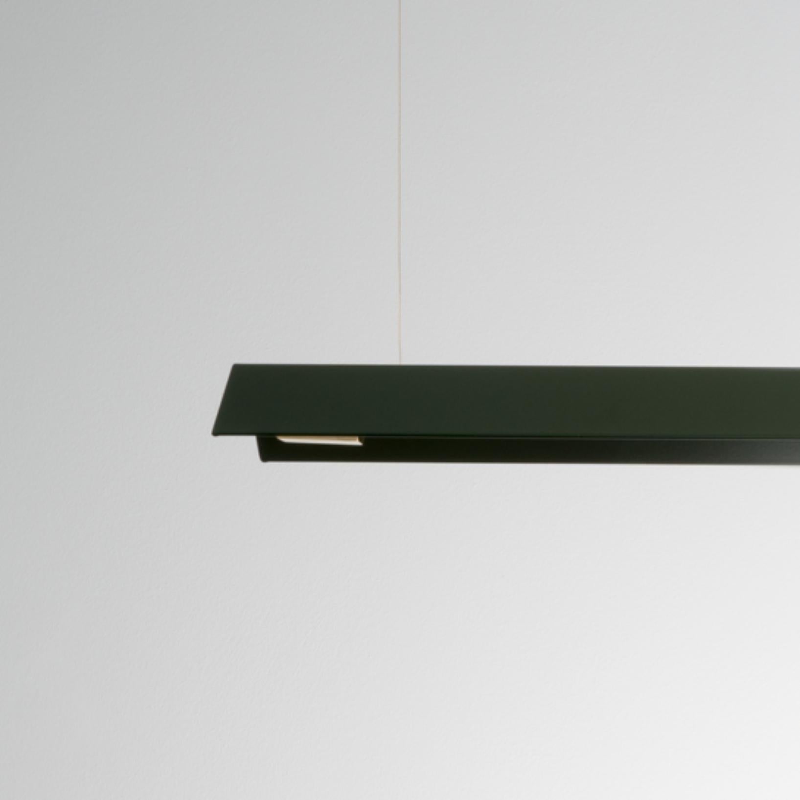 Large Misalliance Ex bottle green suspended light by Lexavala
Dimensions: D 16 x W 130 x H 8 cm
Materials: powder coated shade with details made of brass or stainless steel.

There are two lenghts of socket covers, extending over the LED. Two