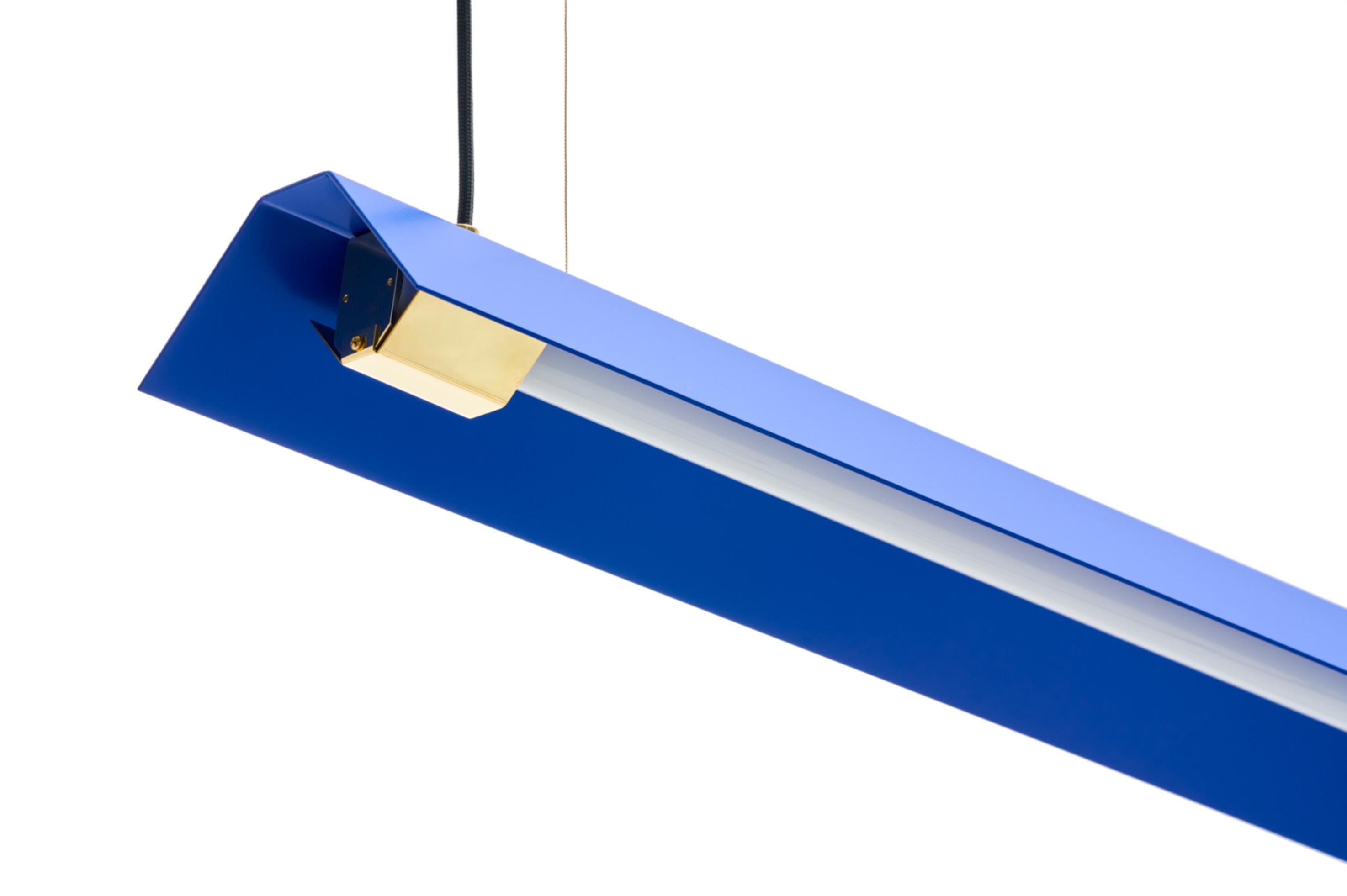 Large Misalliance ex ultramarine suspended light by Lexavala
Dimensions: D 16 x W 130 x H 8 cm
Materials: powder coated shade with details made of brass or stainless steel.

There are two lenghts of socket covers, extending over the LED. Two