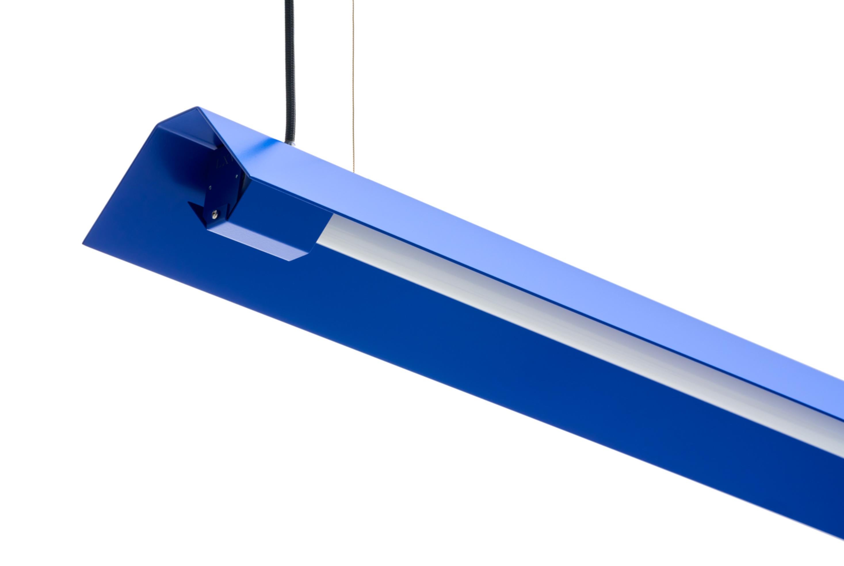 Large Misalliance Ral ultramarine suspended light by Lexavala
Dimensions: D 16 x W 130 x H 8 cm
Materials: powder coated aluminium.

There are two lenghts of socket covers, extending over the LED. Two short are to be found in Suspended and