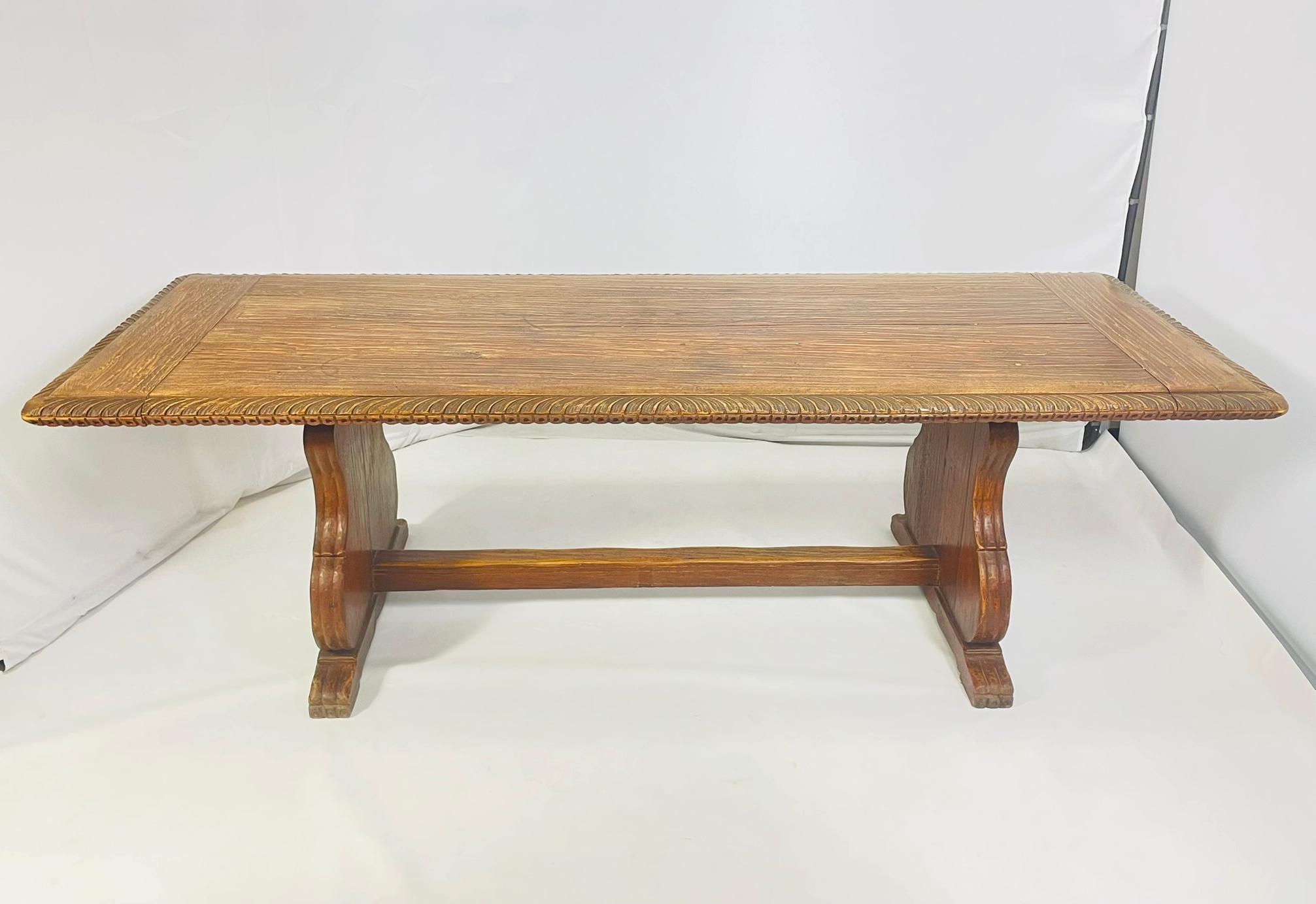 Stunning dining table made in solid wood with hand carved details.

Very unique piece of furniture dating from the 1940's or earlier.

Unmarked.

The hairs shown with the table are available but do not come with the table.

Measurements:
96 inches