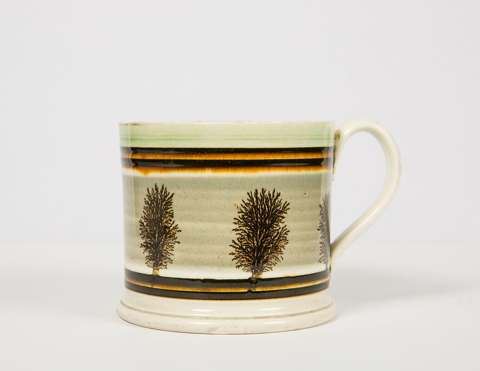 WHY WE LOVE IT: A perfect combination of form and decoration
We are delighted to offer this mochaware quart mug. Made in England, circa 1825 it is a masterpiece of mochaware. It has a strong presence and is beautiful. The decoration all works
