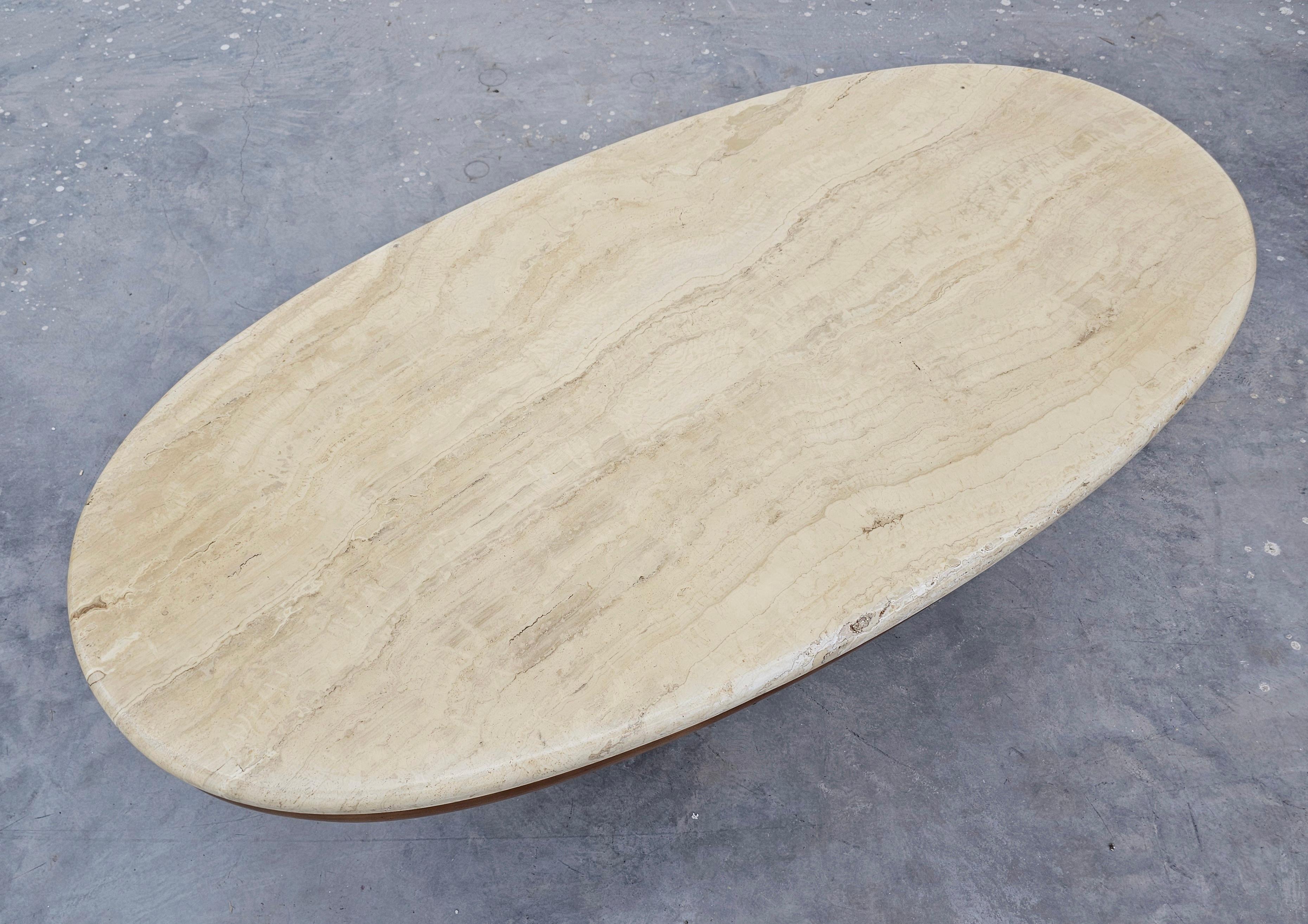 In this listing you will find an exceptionally attractive sofa table done in walnut with travertine top. Table features oval shape, two demilune legs and a small drawer beneath the table top. Made in Italy in the 1970s.

Good vintage condition with