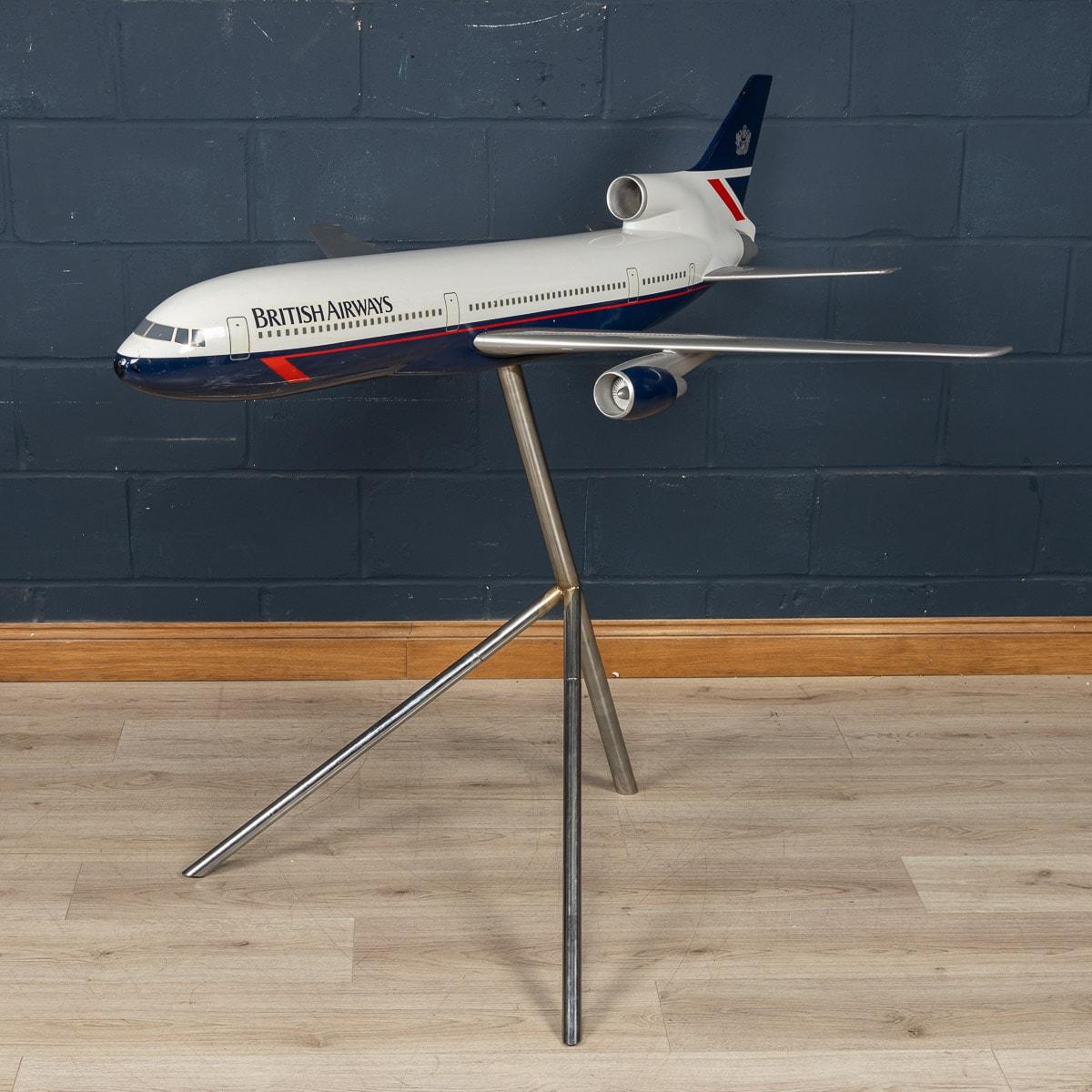A stunning vintage fibreglass and plastic composite model of a Concorde in full British Airways livery mounted on a tripod stand by Space Models, circa 1990. This 1:36 scale aircraft model would have been presented to one of BA's top travel agents