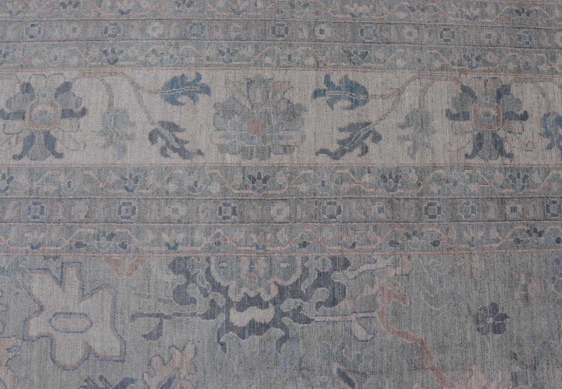 Very Large Modern Afghan Oushak rug with soft floral motifs on light gray background. Keivan Woven Arts; rug AWR-556 Country of Origin: Afghanistan Type: Oushak Design: Floral, 

Measures: 13'10 x 19'5 

This grandiose Oushak features a wide border,