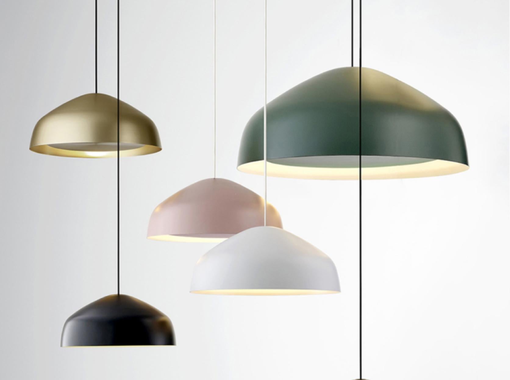 Sitting between the timeless and the contemporary, the Ora pendant by Ross Gardam, features a floating disk surrounded by a beautifully gentle glow. This striking gold shade is hand-spun, anodized aluminum and includes a 5