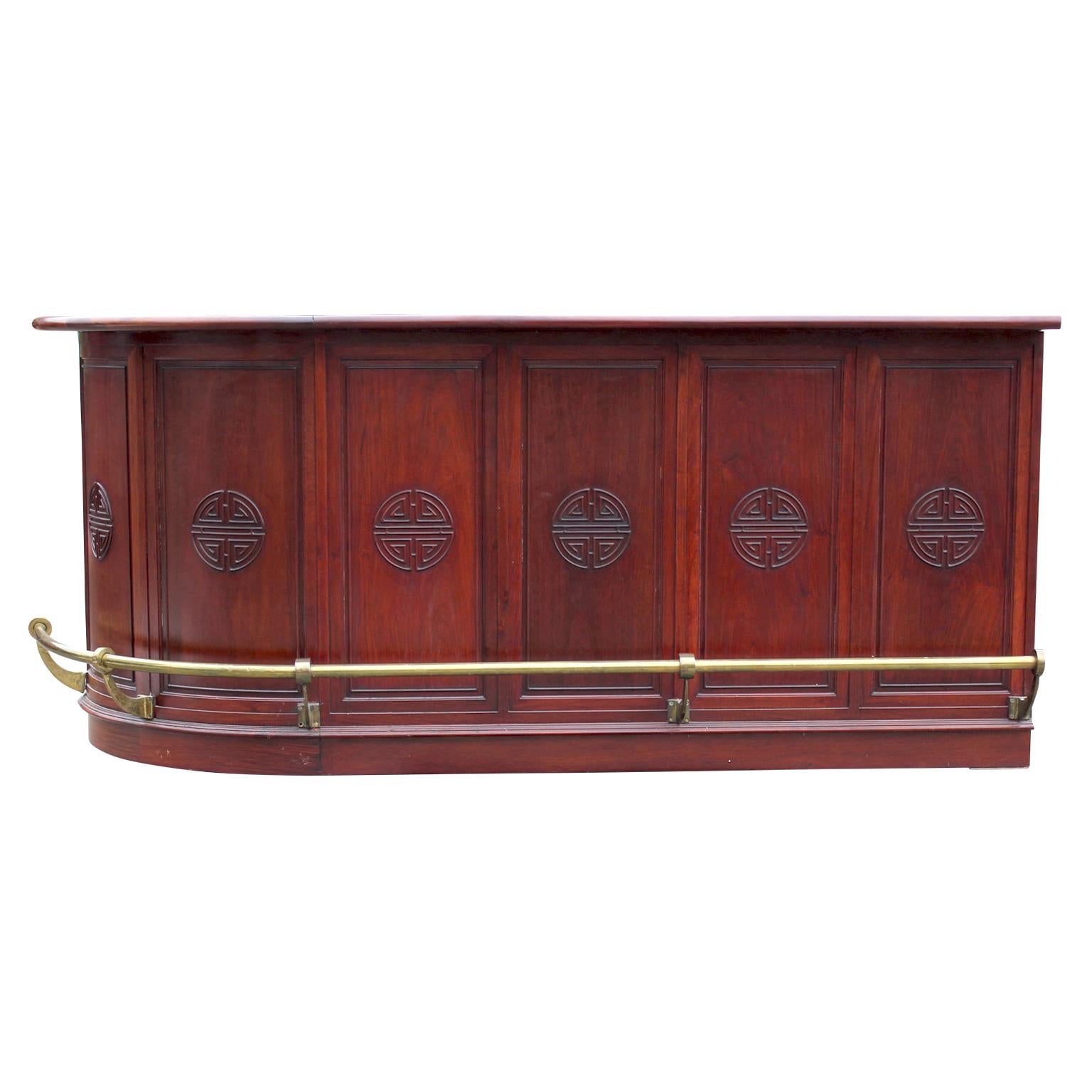 Beautiful large modern rosewood chinoiserie counter serving bar with brass detailing and plenty of storage. The right cabinet opens to reveal a single shelf. Other shelving can be seen in the photos.