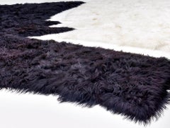 Collectible design large black sustainable sheepskin rug by Roos Schneijderberg