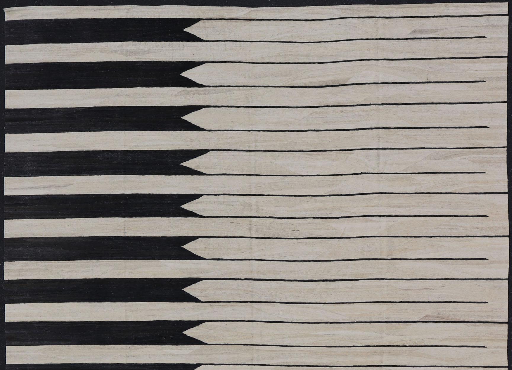This modern Kilim features an abstract casual design with horizontal design reaching the other side. Colors are black and ivory. 

Measures; 13'3 x 15'7

Country of Origin: Afghanistan Type: Modern Kilim Keivan Woven Arts; rug AFG-43446 Design: