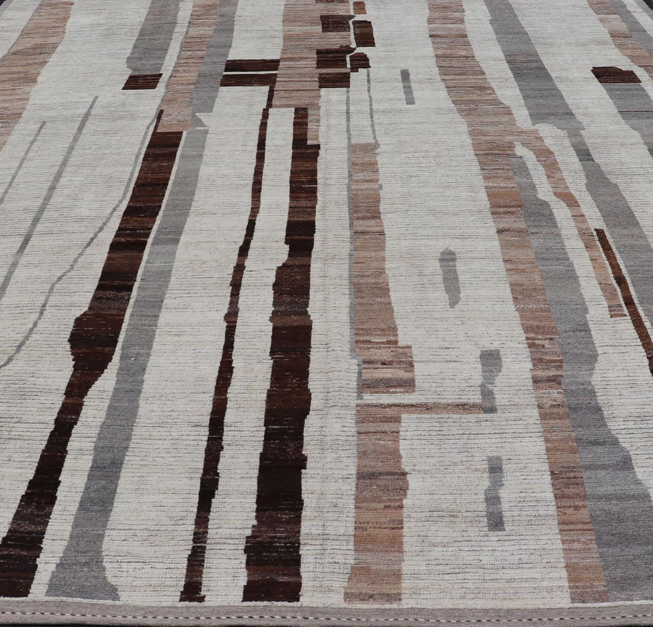 This attractive modern casual features light mocha brown, Ivory, charcoal, and gray abstractions on a ivory background. The modest earthy tones make this piece a great accessory to a number of interiors. 

Measures; 13'2 x 16'10 

Keivan Woven