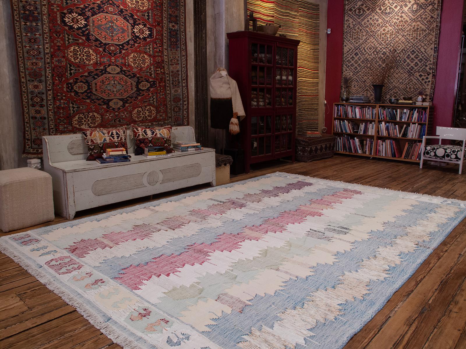 A large, modern kilim woven with upcycled cotton rag, featuring a design inspired by antique Anatolian kilims.