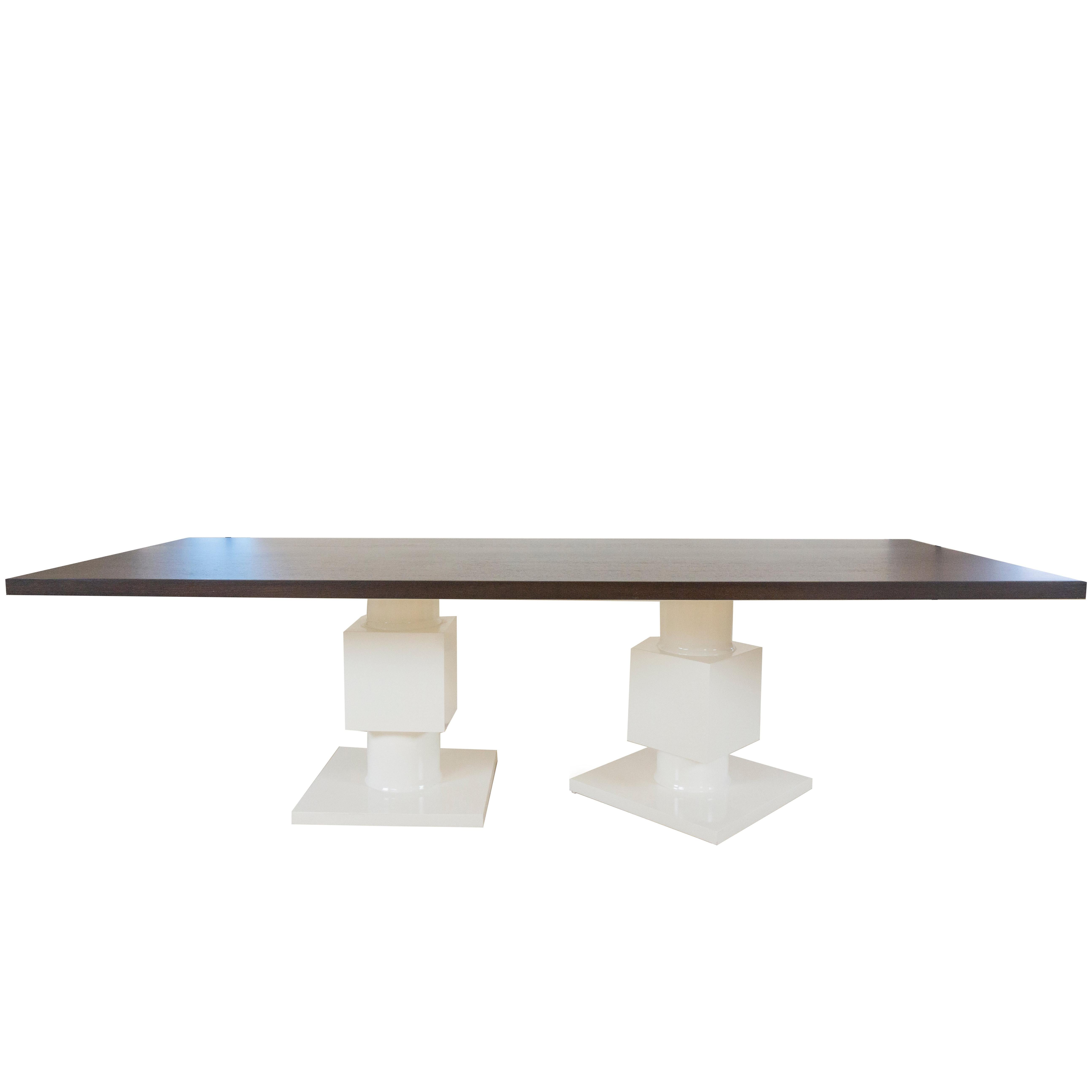 This large modern dining table is a whimsical take on our popular Gabietta table. The wenge wood top has an oil finish and is visually striking and durable and the base has asymmetrical legs lacquered in white. 

Measurements:

108