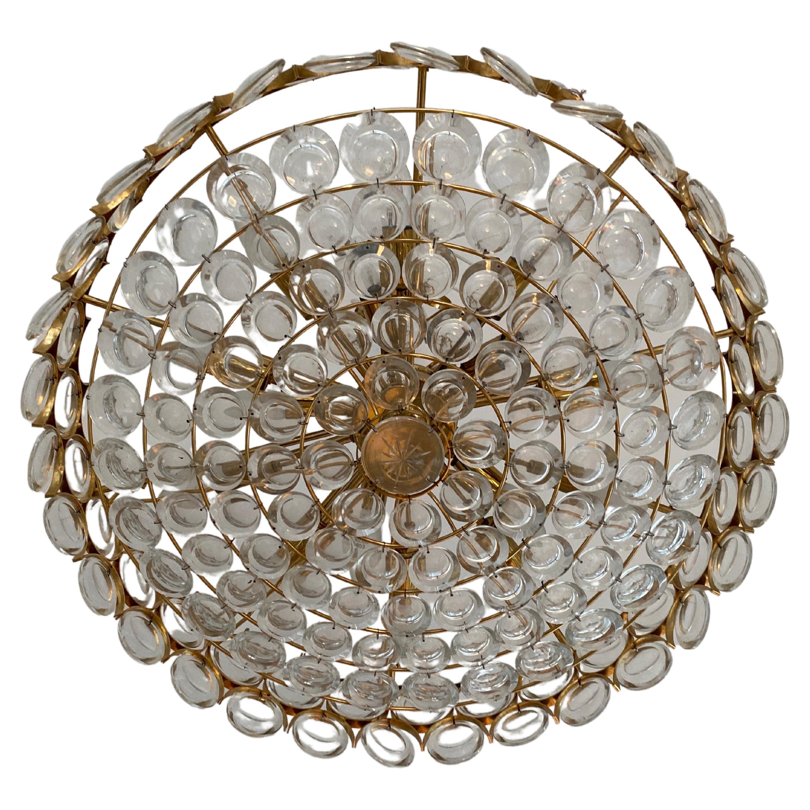 A beautiful Mid-Century ceiling chandelier manufactured by Palwa, Germany, 1970s.It is made of a 24-carat gold-plated brass frame decorated with individual 